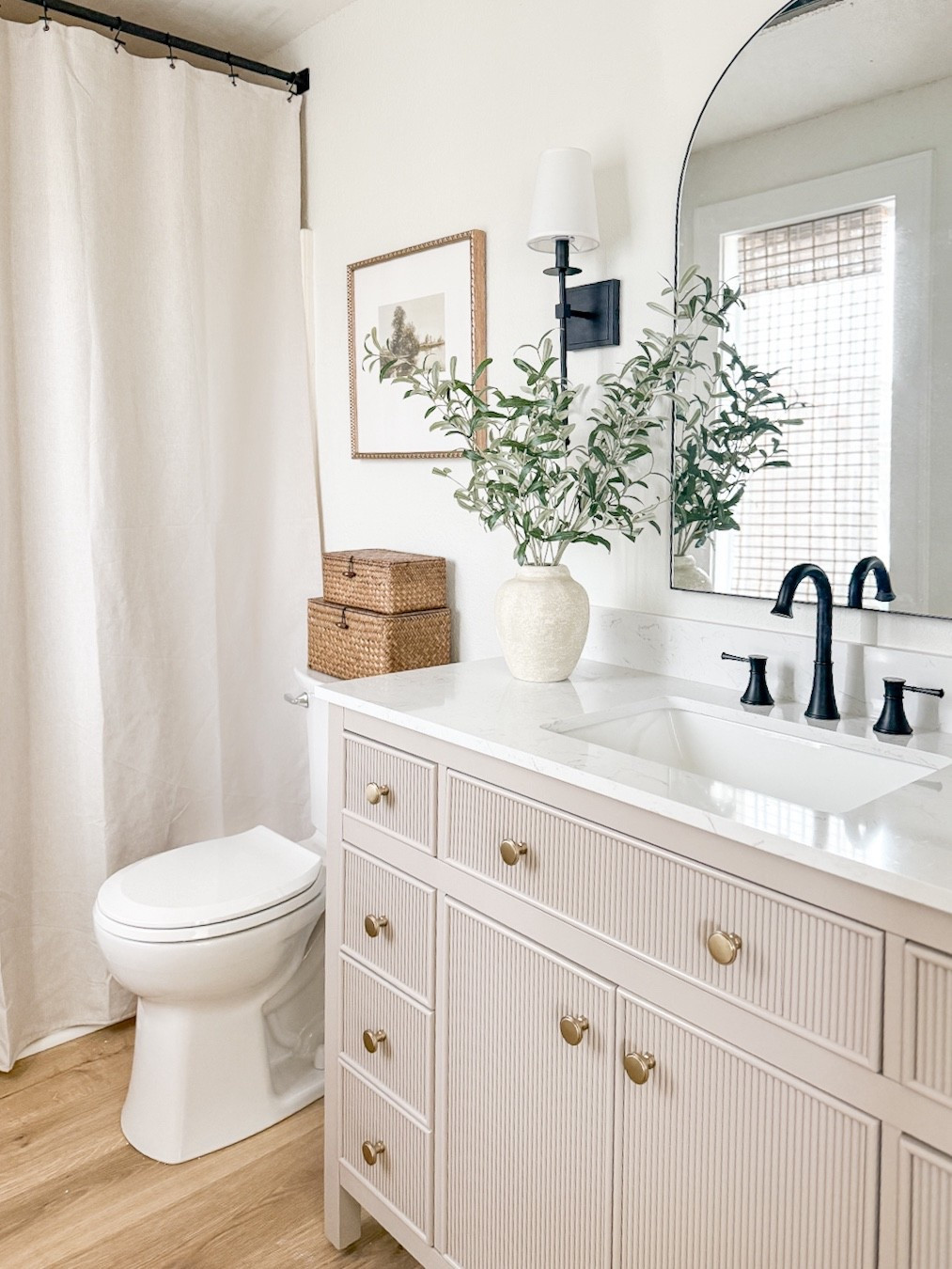 Bathroom design inspo, love this vanity! 

Bathroom vanity, bathroom cabinet , arched mirror, bathroom faucet, faux greenery, shower curtain, bathroom decor 

#LTKHome #LTKSaleAlert