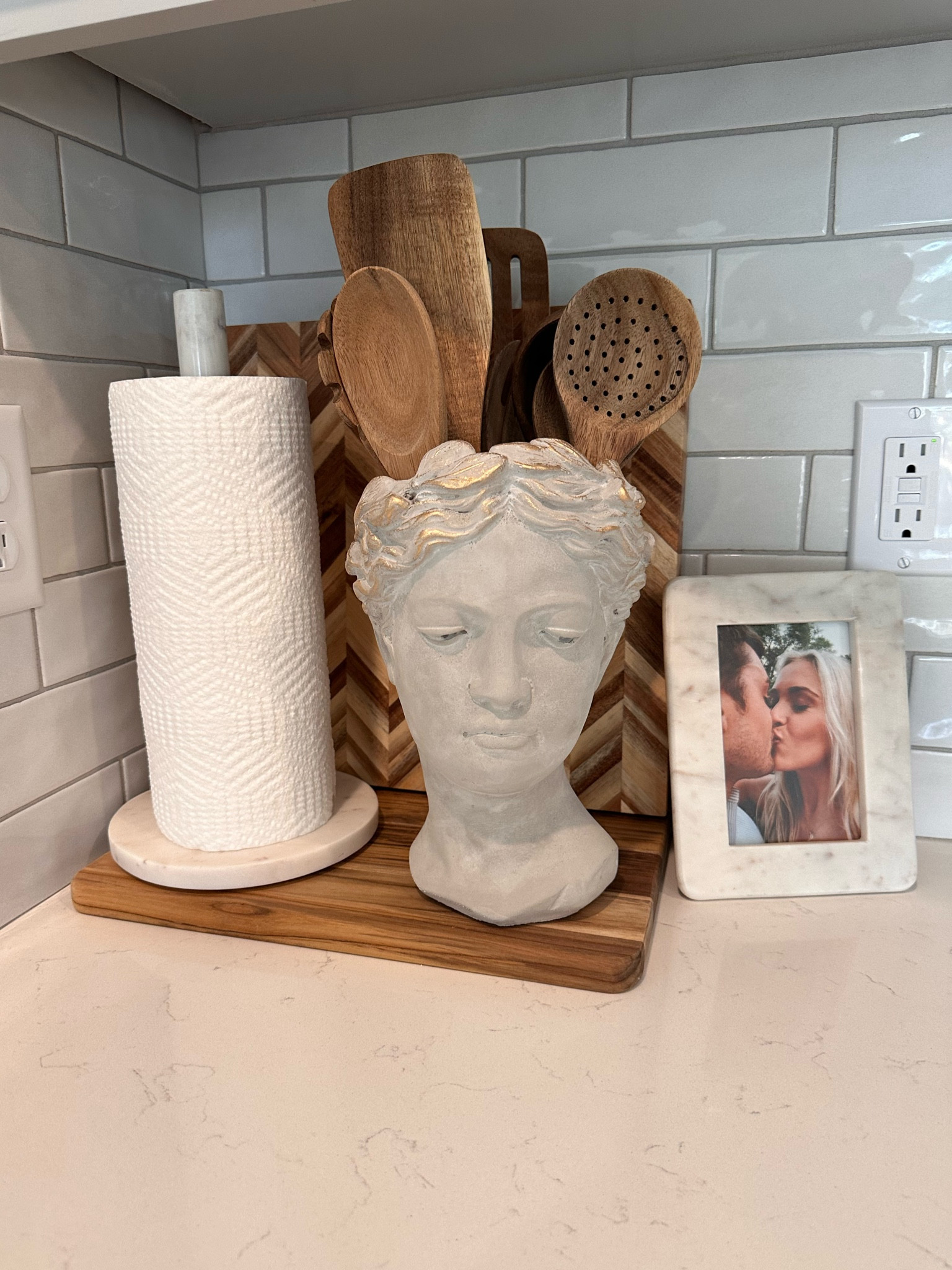My cozy corner in the kitchen 🫶🏼

I love this Greek head planter that is multi purpose 🤎 size large from Anthropologie. 

Also these wooden spoons (Amazon) and cutting board (crate and barrel) are my favorite 🫶🏼

Paper towel holder - home goods (linked similar) 

Picture frame - Target (linked similar) 

#LTKCyberWeek #LTKFindsUnder100 #LTKHome