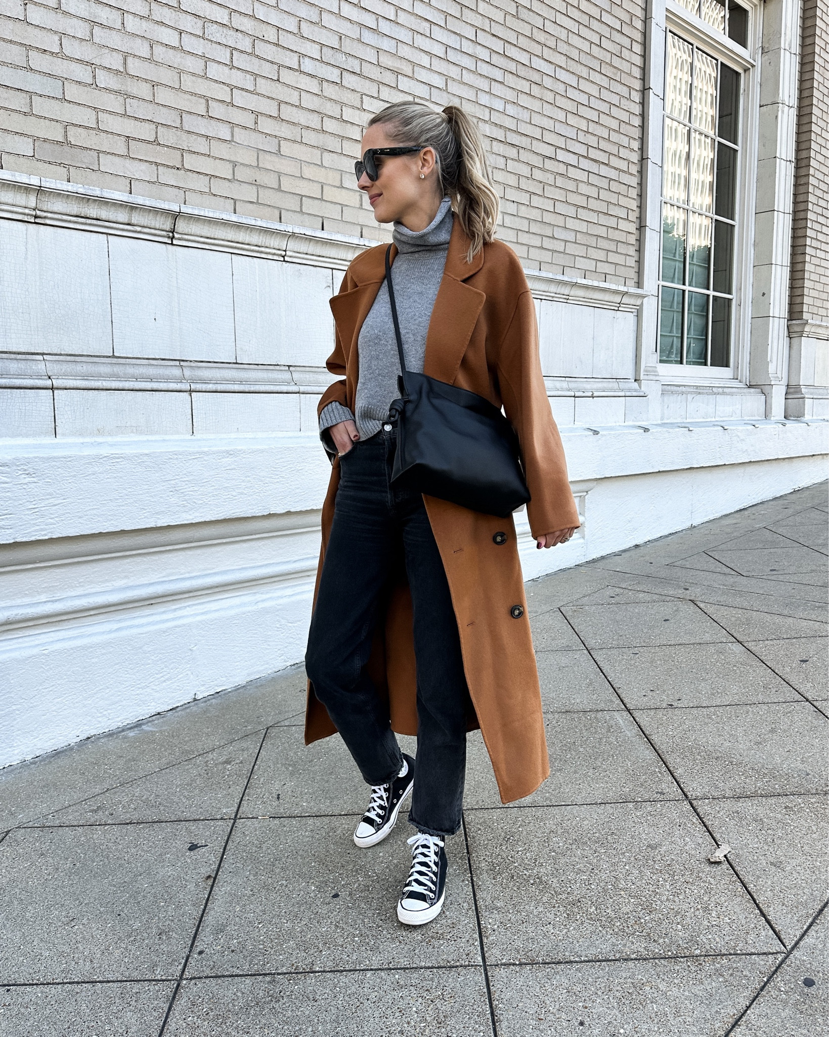 Fashion Jackson wearing camel coat, grey sweater, black jeans, converse sneakers, winter outfit #converse #sneakers #fashionjackson  

#LTKstyletip #LTKshoecrush #LTKunder100