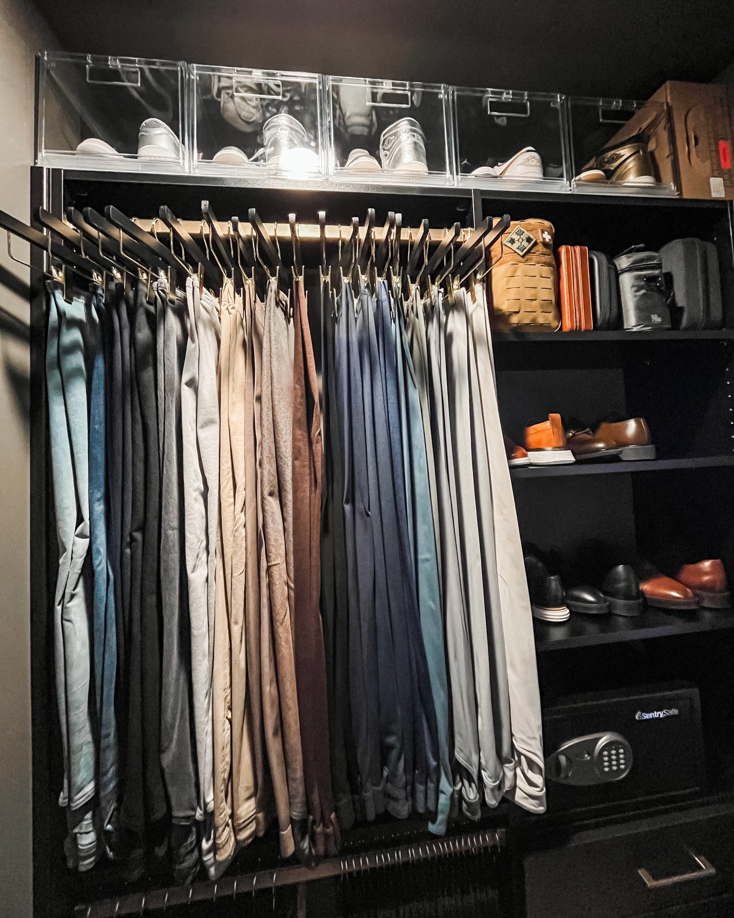 We love the moody black closet trend. Proper lighting and clear shoe bins are key to making it fully functional and we love the end result! 🖤 

 
