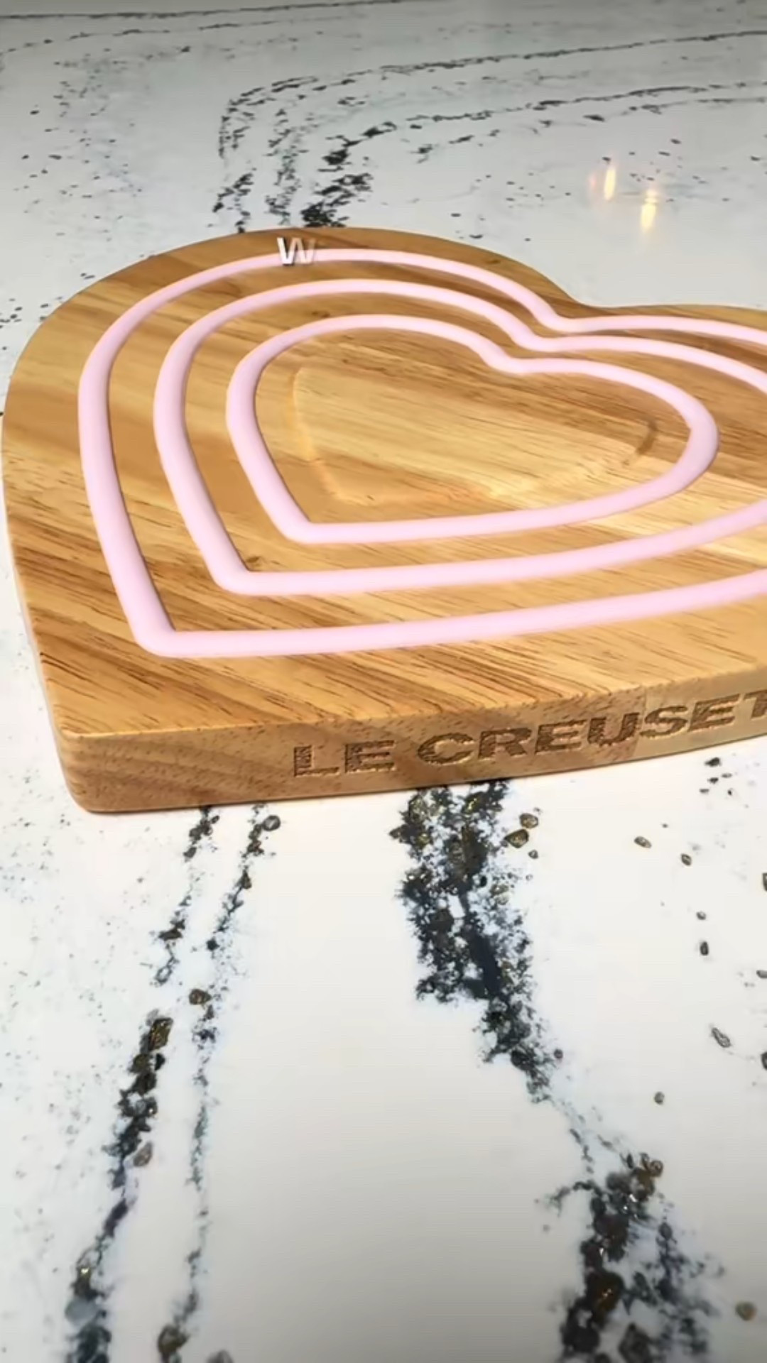 This might be the cutest functional kitchen piece I own. The heart trivet actually magnetically attaches to the bottom of metal cookware, so when you lift a hot pan, the trivet comes with it — no scrambling to protect the counter. The acacia wood is beautiful, the pink silicone rings handle the heat, and it’s one of those pieces that’s practical and pretty enough to leave out year-round.

#LTKhome #kitchenfinds #lecreuset #homedecor 

#LTKOver40 #LTKfoodie #LTKHome