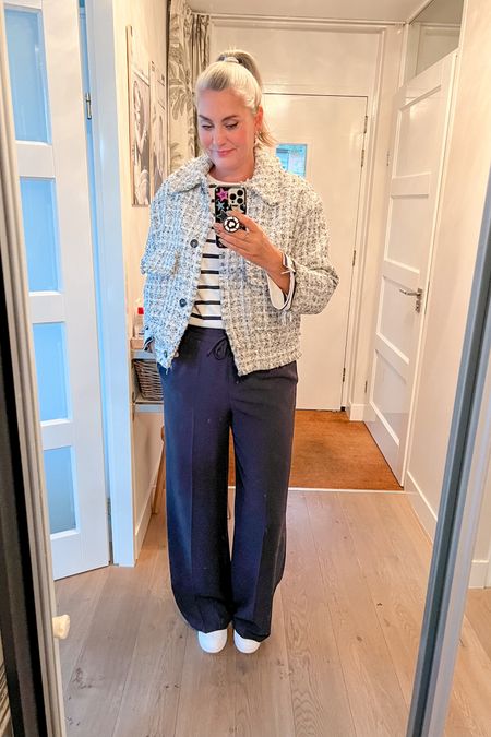 Office day wearing a striped shirt under a bouclé or tweed jacket (old H&M and Zara but I have linked similar items) and navy blue wide legged trousers. White Puma sneakers  



#LTKover40 #LTKworkwear #LTKmidsize