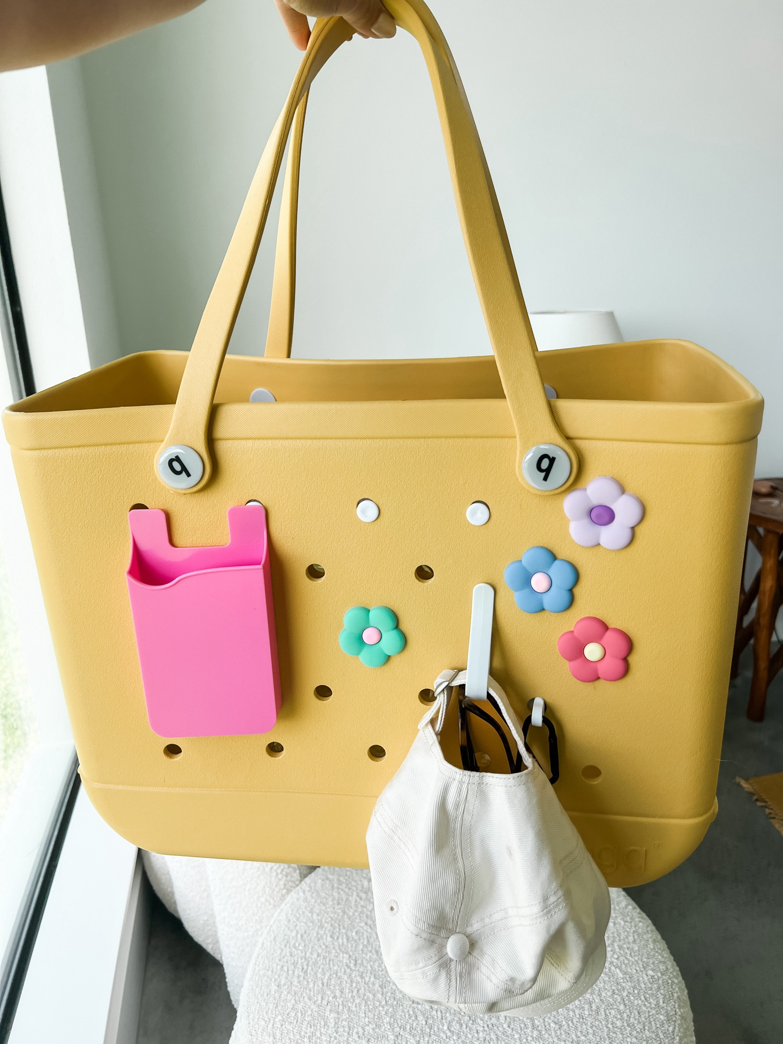 Bogg bag with all her cuteness and new accessories! 🌸 

#LTKSwim #LTKItBag #LTKSaleAlert