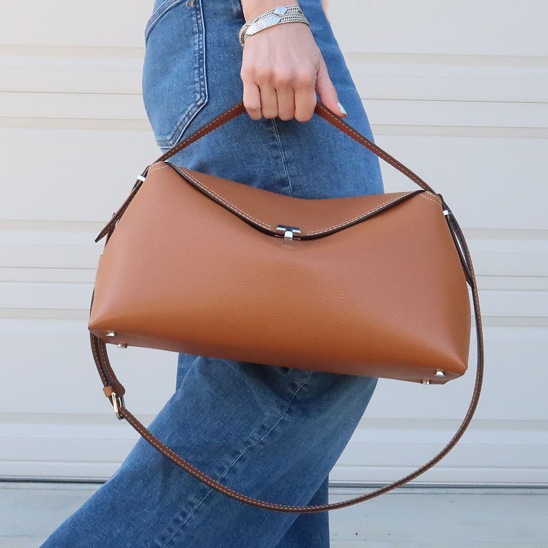 Love this investment handbag. It has high quality materials and craftsmanship. I love how it can be worn with the top strap, or the shoulder strap. It is such a versatile handbag! Love that! 

 #LTKOver40 #LTKStyleTip #LTKItBag