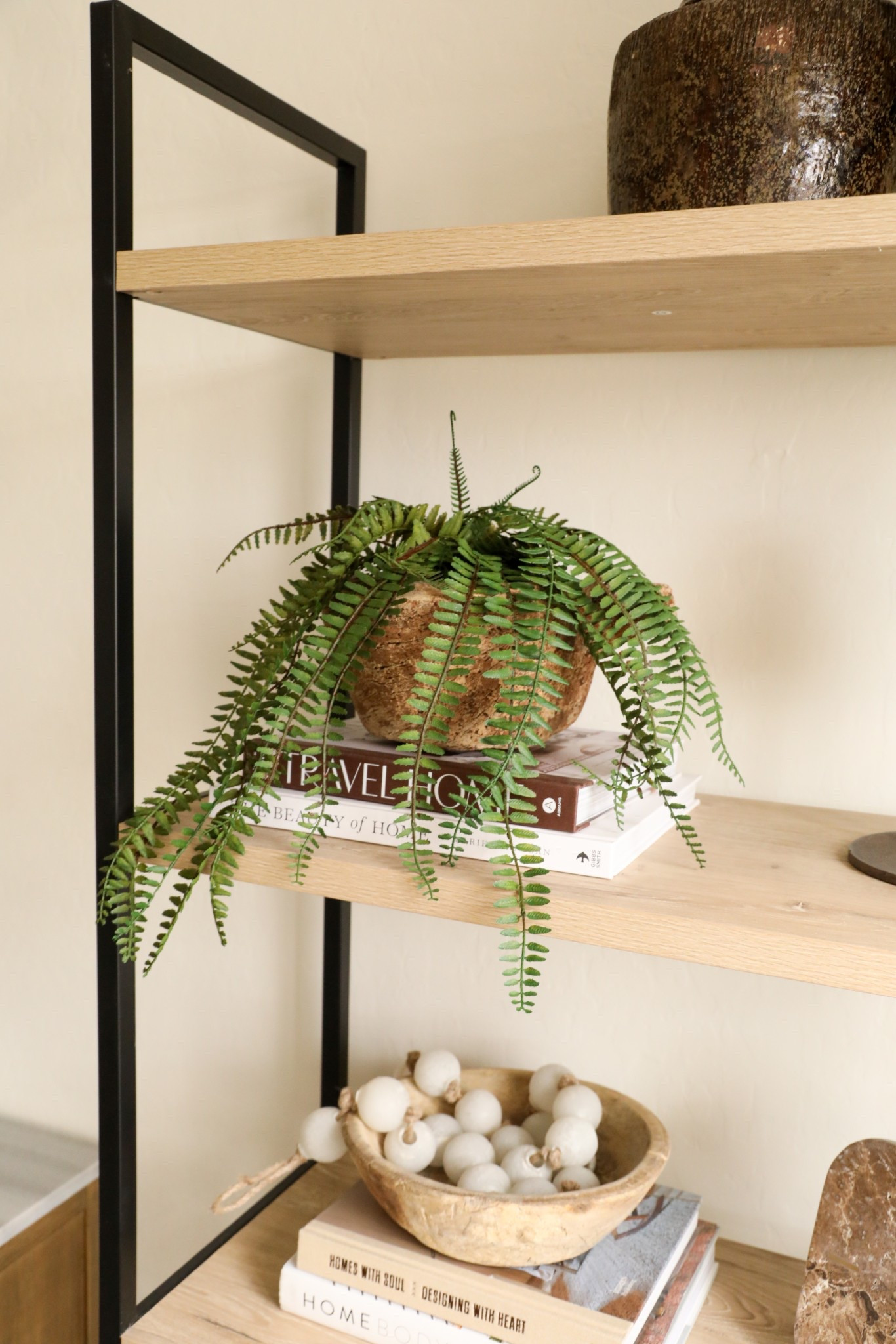 I love this affordable faux fern to help add some movement and visual interest to a shelf! 🪴😍✨ #springdecor #homedecor #ltkhome #fauxplant #rusticdecor 

#LTKStyleTip #LTKHome