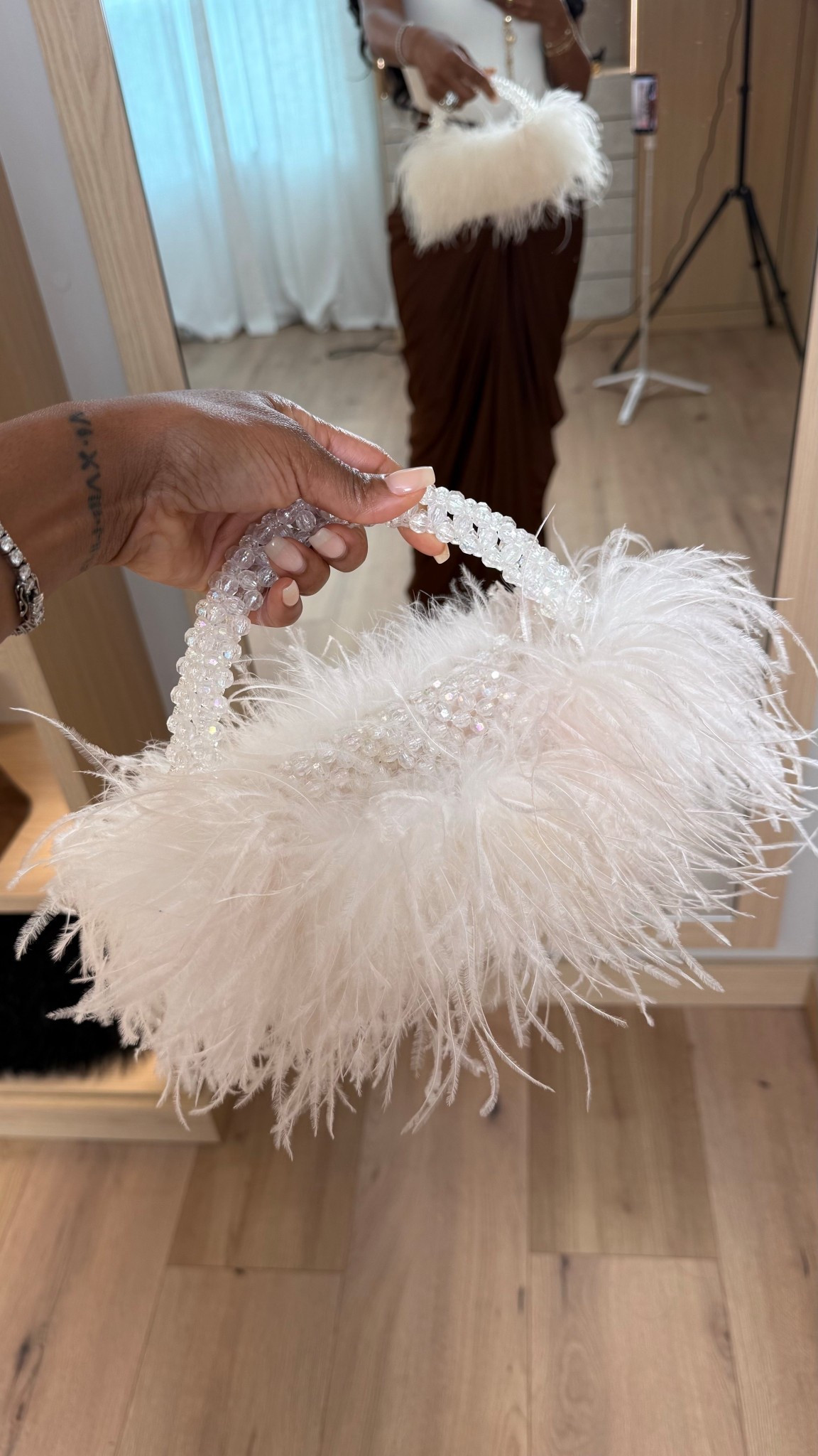 This feather mini bag is the definition of a statement accessory — playful, elevated, and instantly glam. It adds texture and personality to even the simplest outfit, making it one of those pieces that transforms a look the moment you carry it.

Styled multiple ways, this is the kind of accessory that elevates date nights, weddings, cocktail events, holiday parties, or any moment you want a little extra drama. The cost per wear drops fast because it works across so many outfits and seasons.

Perfect for nights out, special occasions, bachelorette dinners, birthdays, and fashion-forward events.

📏 Sizing & Fit Details  
One size statement mini bag  

Tap to get details and shop this accessory before it sells out.

Feather handbag, statement mini bag, evening clutch alternative, glam accessories, date night bag, holiday party purse, cost per wear fashion

Follow me on Instagram and YouTube @kirasfashionfinds 

#LTKootd