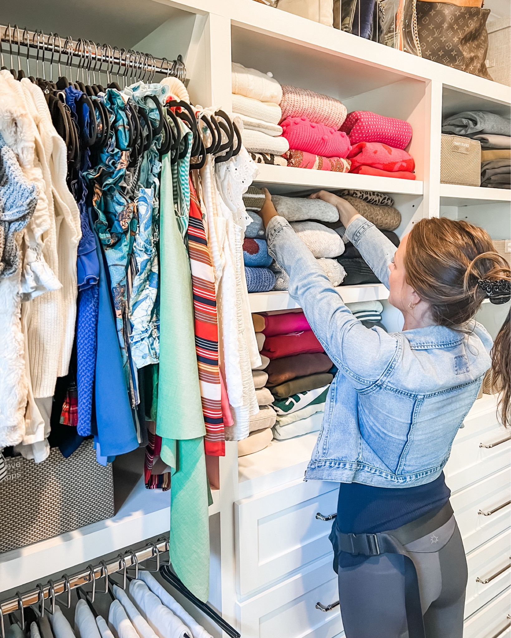 Our organizers love putting the finishing touches on closets. It takes a bit of time, but making sure that each sweater is folded the same way and to the same size makes for perfect little stacks - which, in turn, makes for a perfect looking set of shelves! It's not just about the look (though it is so satisfying!) but when the stacks are consistent like this, it makes it so much easier to find what you are looking for.