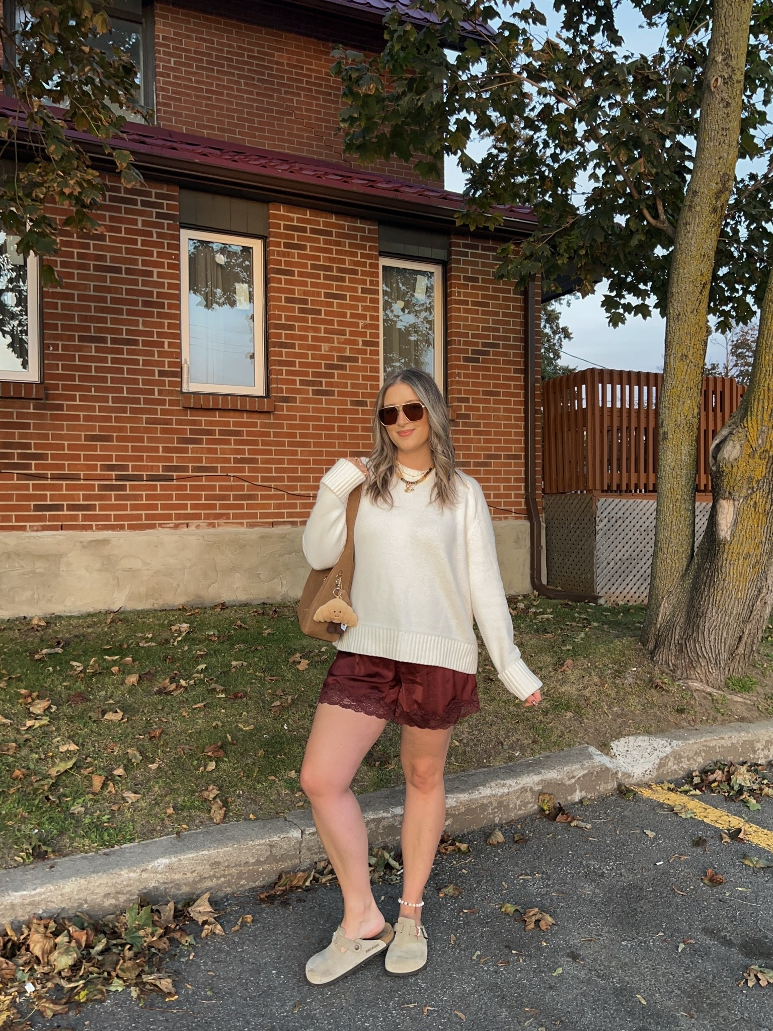 Comfy fall outfit! Sized up to XL in the sweater for an oversized fit. Wearing M in the satin lace shorts. I’m a 9.5-10 shoe and wear a 40 in the Birkenstock clogs