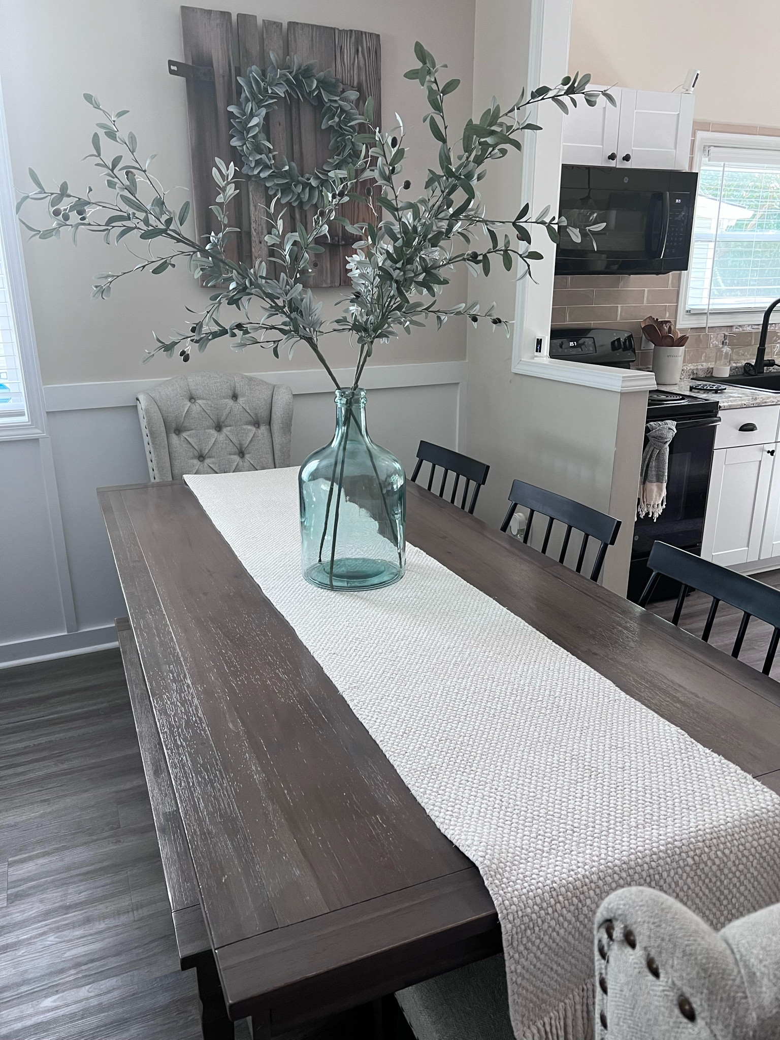 The glass vase is  from target hearth and hand collection a few years ago. Table and bench are for Pier 1 several years ago the fabric chairs are thrifted.