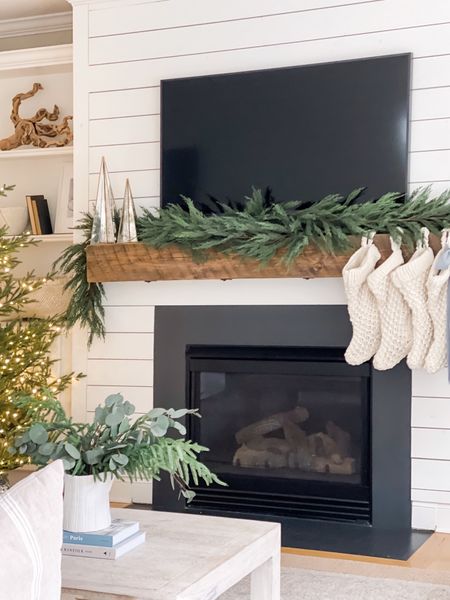 Living room Christmas decor with fireplace garland and stockings from amazon. 



#LTKhome #LTKHoliday #LTKSeasonal