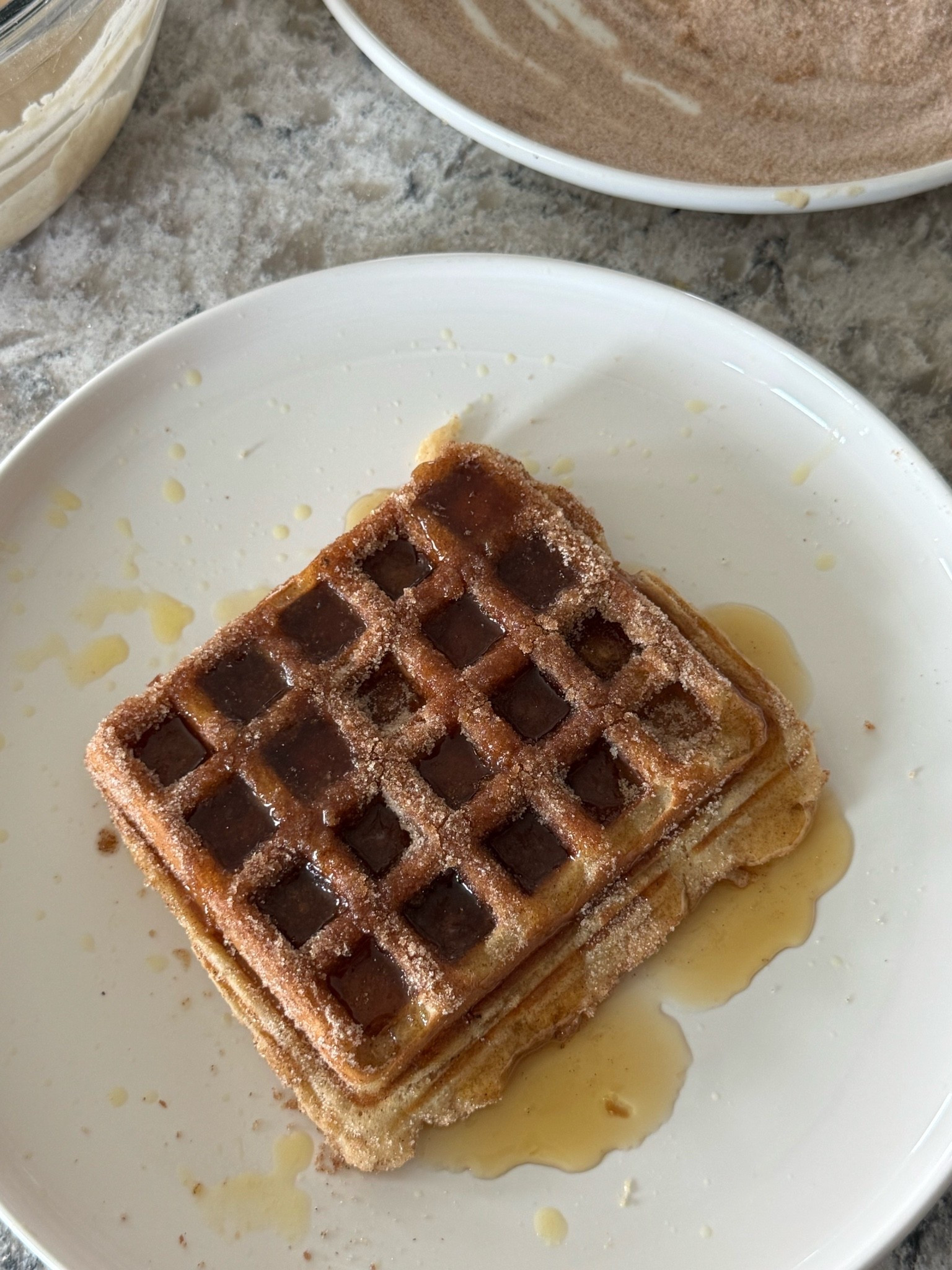 -✨ Still dreaming about the churro waffles from Crystal Palace, so I had to recreate them at home! 🏰🤍 They came out SO good and are the perfect way to bring a little Disney magic into your kitchen. ✨

Recipe
🥞 2 cups Hungry Jack Complete Pancake & Waffle Mix
🥛 1¼ cups whole milk
🥚 1 egg
🧈 2 tbsp melted butter
🥄 2 tbsp dry milk powder
🥄 1 tbsp sweetened condensed milk
🍦 1 tsp vanilla
✨ ½ tsp cinnamon

Mix until just combined and let the batter rest for 10 minutes. Cook until the waffles are deep golden brown.

Churro Coating:
🧈 Brush each hot waffle with melted butter, then coat in:
✨ ½ cup sugar + 1½ tsp cinnamon

Serve warm with maple syrup and enjoy a little taste of Disney at home. 🏰💛

Have you tried the churro waffles at Crystal Palace yet? Would you order them again? 👇✨

#CrystalPalace #DisneyFood #DisneyRecipes #MickeyWaffles #DisneyReels

#LTKfoodie #LTKmorningroutine #LTKmomlife