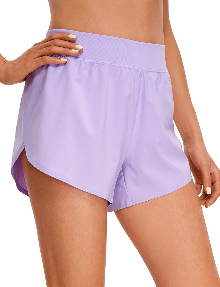CRZ YOGA Mid Waisted Dolphin Athletic Shorts for Women 4" Lightweight High Split for Gym Workout ... | Amazon (US)