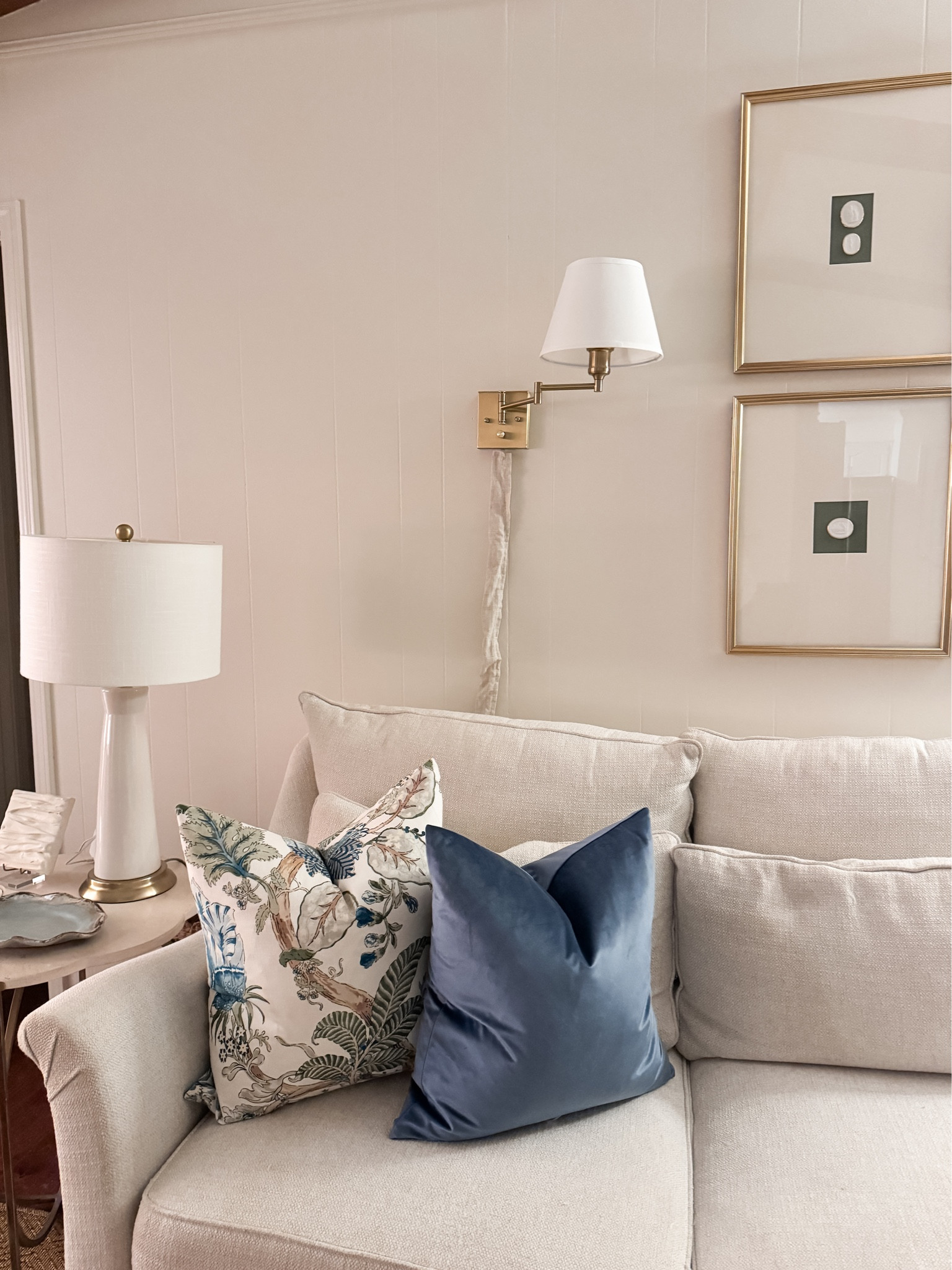 Living room snapshot! Swing arm sconces with linen cord cover, throw pillows, frames and lamp all from Amazon. NEW pillow source @landofpillows with this gorgeous blue and green floral throw pillow #southernstyle  

#LTKfindsunder100 #LTKhome