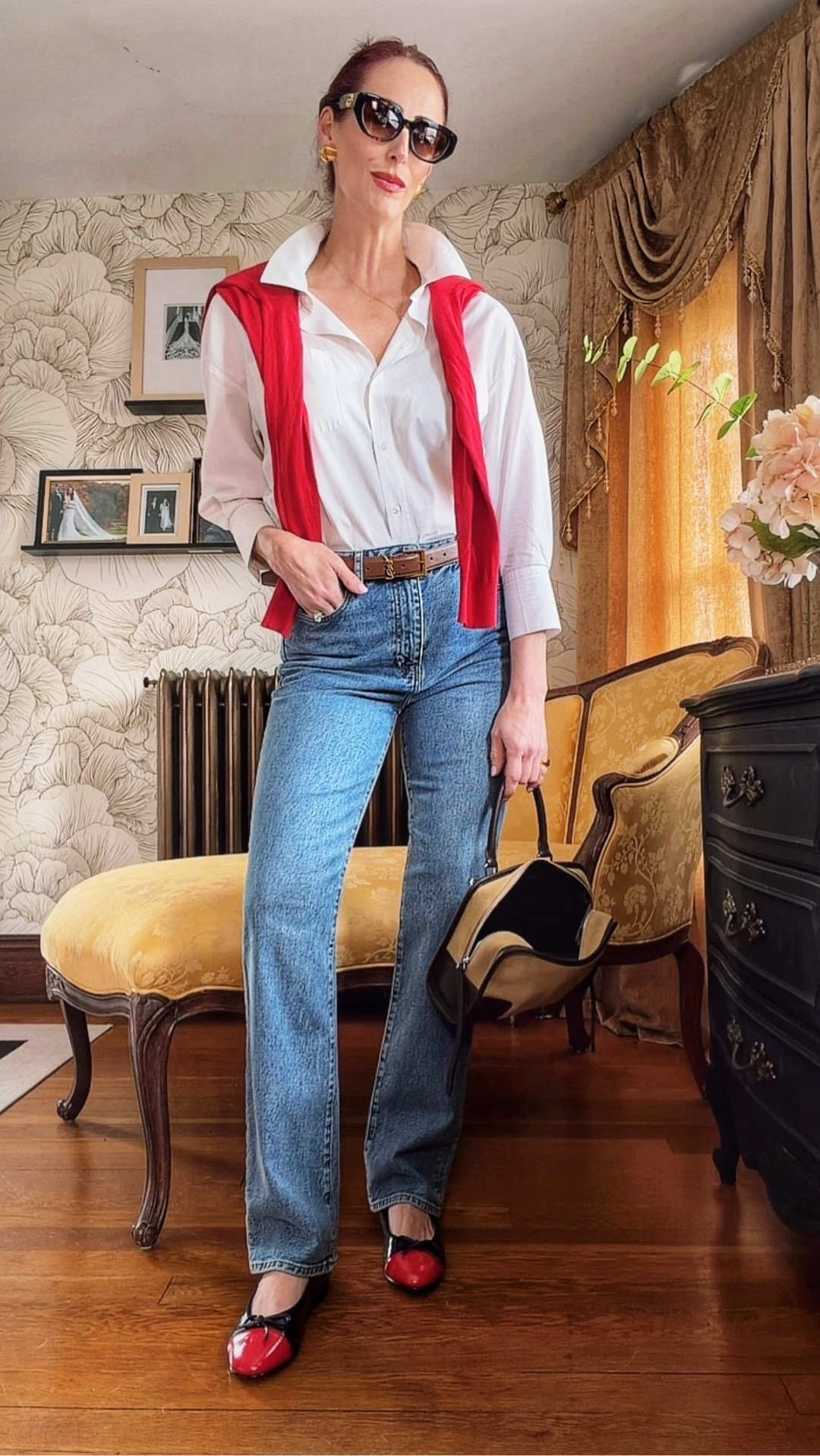 A little Parisian, a little classic American—this outfit is proof that simple pieces styled right always win. 🤍❤️

Crisp white button-down layered with a pop of red (the easiest way to make denim feel intentional), paired with perfectly cut straight-leg jeans and finished with two-tone ballet flats for that timeless, pulled-together feel. The structured mini bag and gold accents tie it all together.

This is your go-to formula when you want to look chic without overthinking it:
button-down + denim + statement layer + classic flats

Everything linked for an elevated everyday look you’ll wear on repeat.

#LTKStyle #LTKFinds #ClassicStyle #EverydayOutfits #CapsuleWardrobe

#LTKootd #LTKstorytime #LTKgrwm