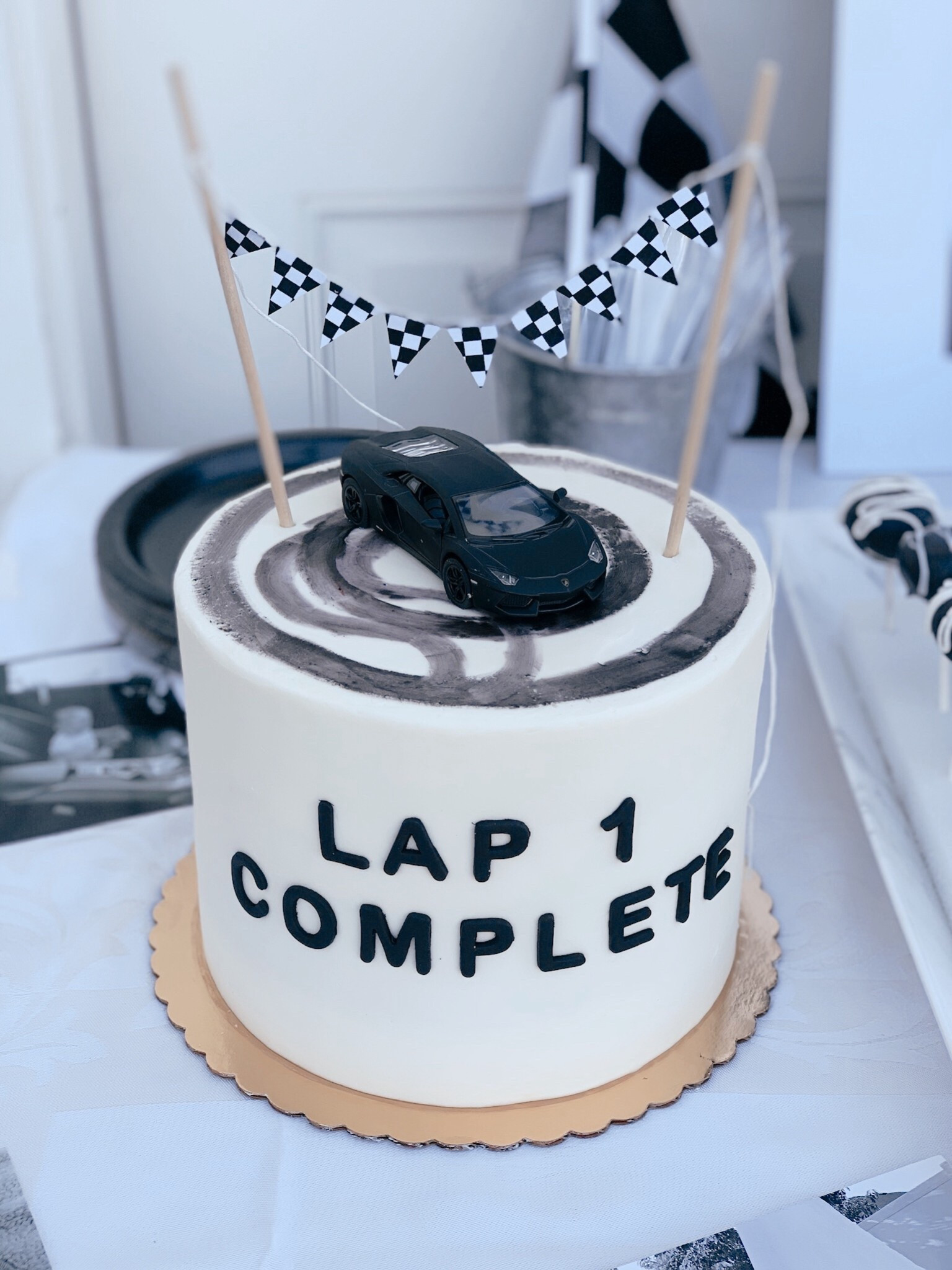 Black and white race car first birthday party for boys #firstbirthdaytheme 

#LTKParties #LTKKids
