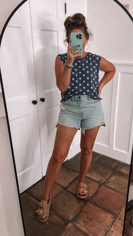 Super cute and comfy outfit for Summer perfect for memorial day Fourth of July or Labor Day.

I took a men’s tank and cropped it about 6-7 inches. I’m wearing a medium, but could’ve gone up to a large.

These shorts are my favorite from Madewell and they’re on sale 25% off. I’m wearing my true size 28. 

The sandals are sold out, but I’m the designer option that is on sale for 65% off right now 



#LTKOver40 #LTKSaleAlert #LTKStyleTip
