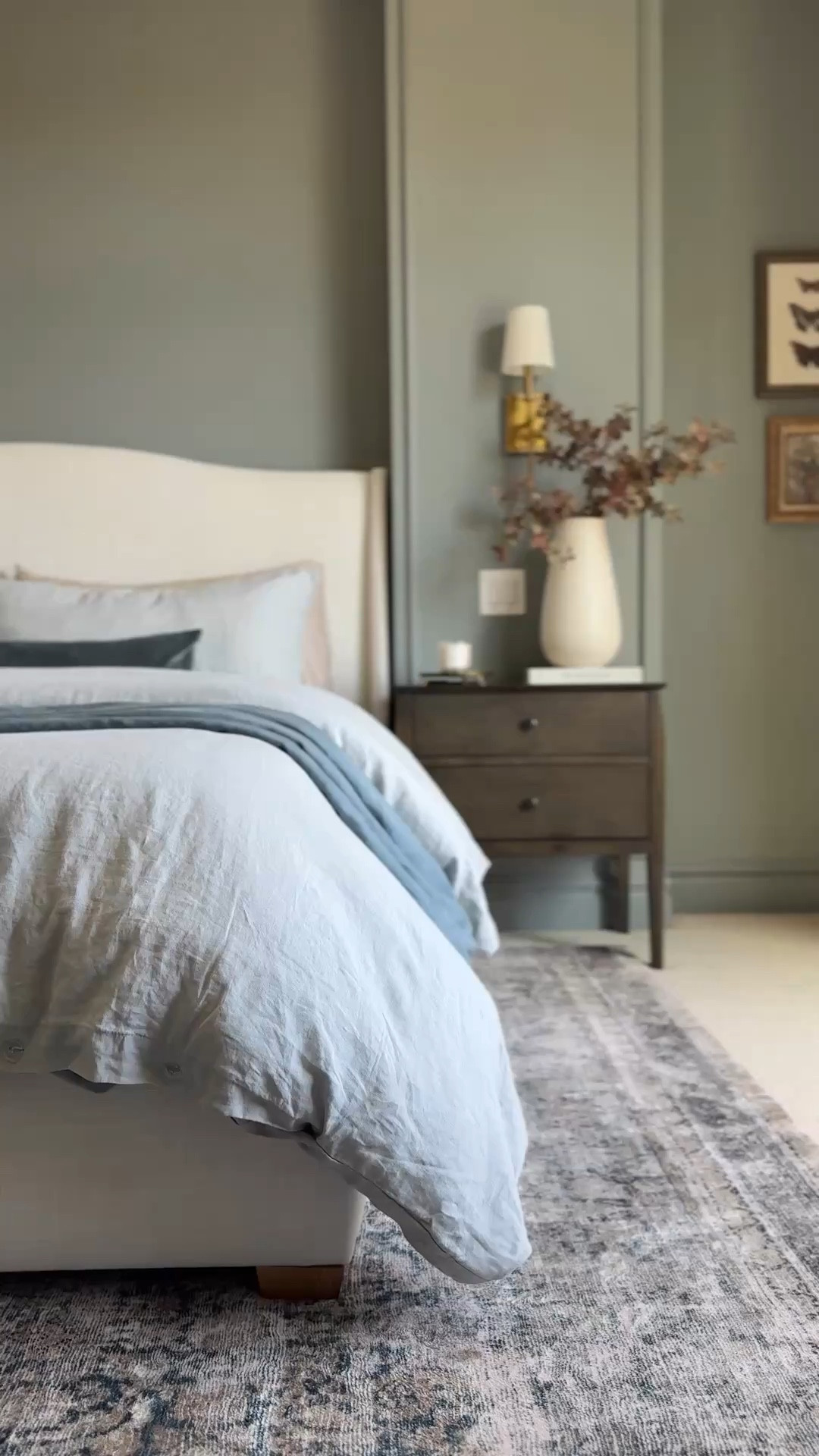 My bedroom may not be “neutral” but the blue paint color  (Dusk blue by Behr… but matched using Sherwin Williams paint) with classic elegant furniture, beautiful
simple luxury feel bedding with just the right number of layers, and the creamy curtains and little decor details make it a serene, cozy sanctuary I love to be in!

Xoxo,
Andrea

#LTKOver40 #LTKHome