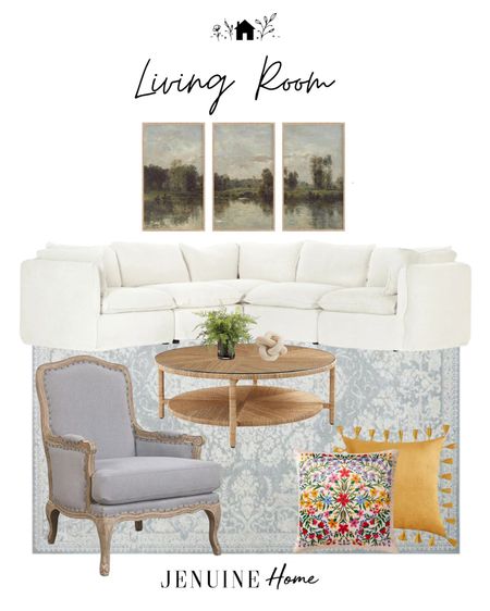 Light traditional living room. White sectional couch. Light wooden round coffee table. Faux plant decor. Marble decor knot. Grey blue French country armchair. Light blue traditional rug. Colourful embroidery throw pillow. Yellow throw pillow with tassels. Vertical trio of landscape art. Gallery art. Painting art  