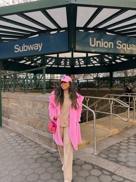 Dressing in a beige sweater set with a bright neon pink faux fur coat makes me feel my best 💖 I found so many similar items from my outfit that are affordable alternatives ✨ Check the post for the items and the exact purse and sneakers I’ve worn 👟 

#LTKfindsunder100 #LTKsalealert #LTKtravel