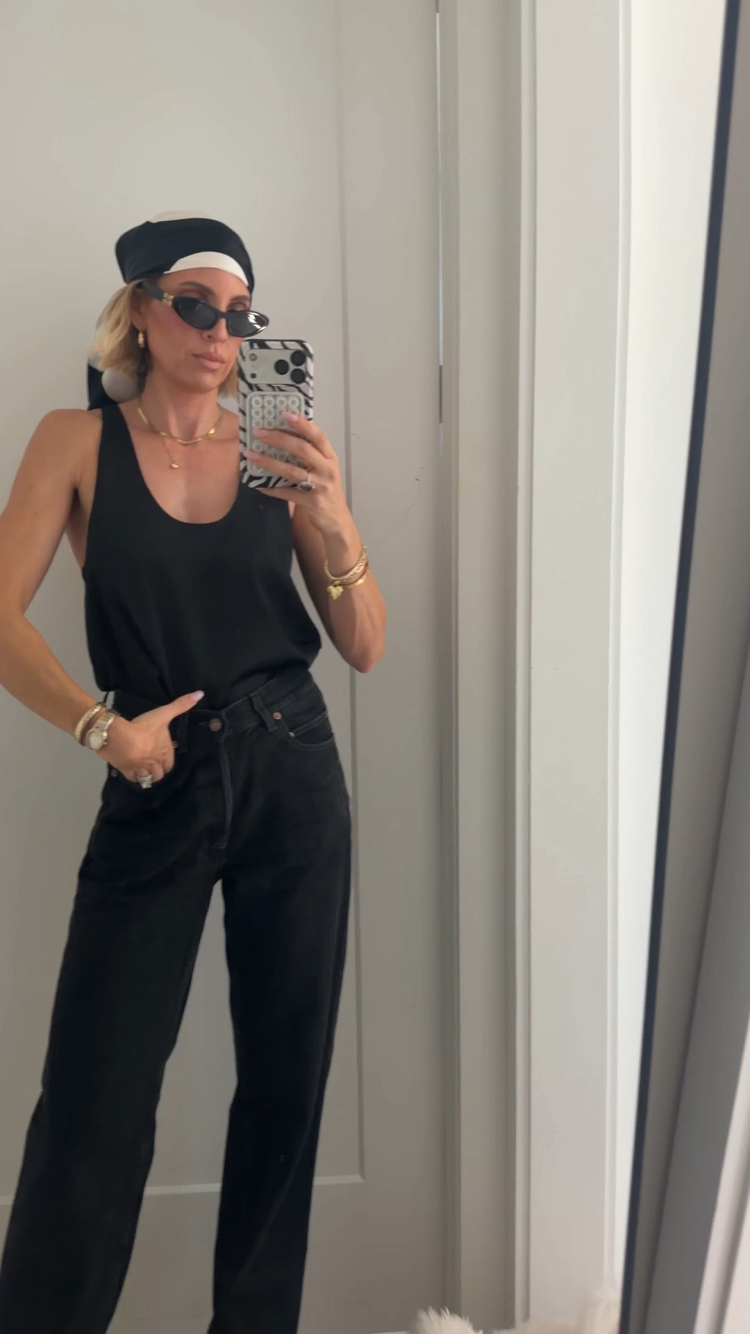 Ok so it’s def giving biker chic 😅 tank is old from H&M, but I linked another one that I just recently bought from Nordstrom‘s. I keep wearing it in the cream so I bought it in black as well. Jeans are tall girl friendly and run TTS. ￼I’m 5’10. Scarf is on sale. ￼

#LTKSaleAlert #LTKOver40 #LTKTall