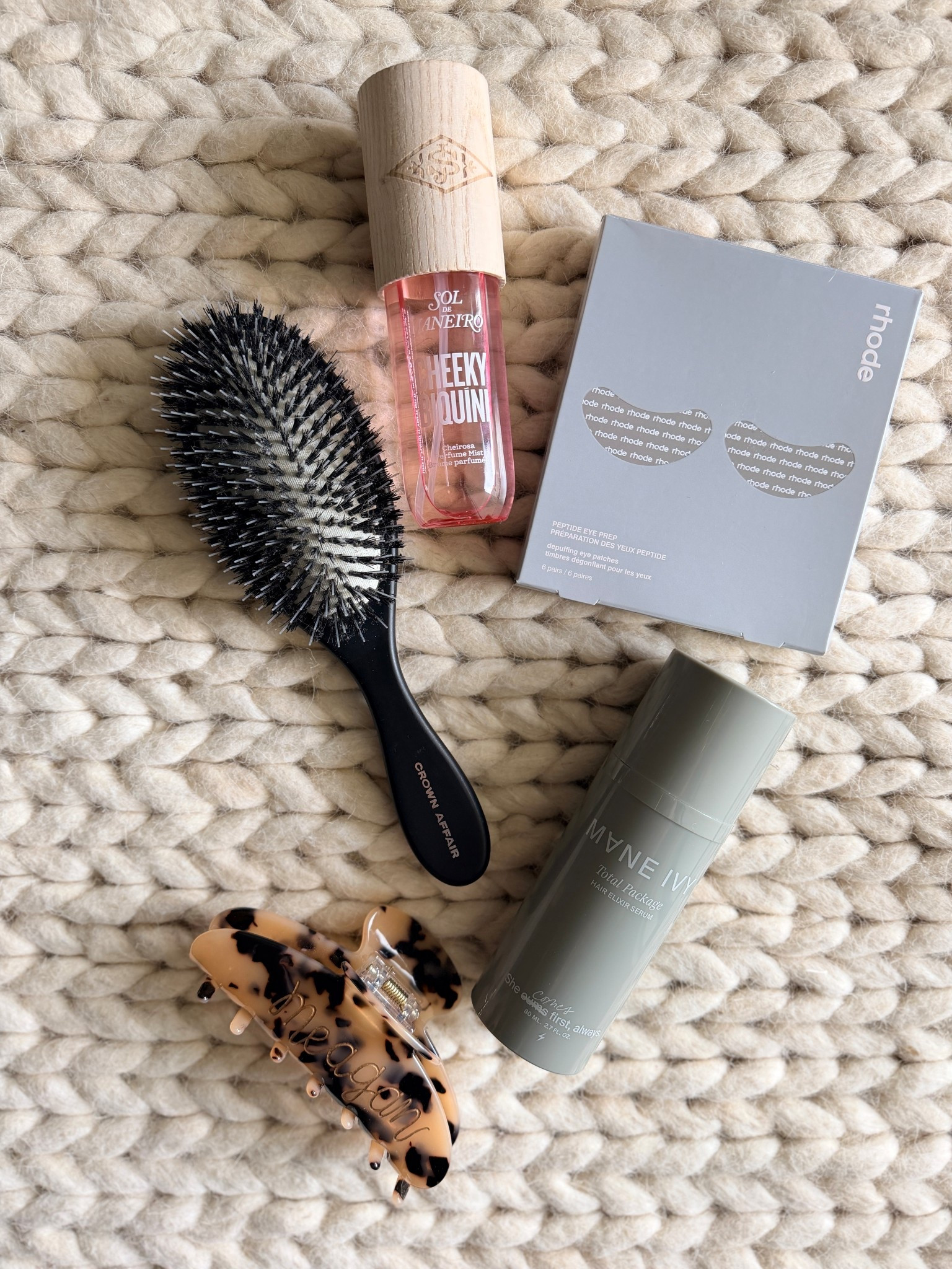 Pre summer essentials I keep reaching for. The Crown Affair detangling brush lives in my bag, customs personalized claw clip for effortless up-dos, Rhode peptide eye patches for quick refresh, hair serum for smoothing + shine, & my latest obsession fragrance mist for that perfect light summer scent. Easy, grab-&-go favorites I use on repeat.

summer essentials - everyday beauty favorites - claw clip hairstyle - hair clip updo - detangling brush - hair serum smoothing shine - under eye patches - peptide eye patches - summer beauty routine - quick refresh beauty - travel beauty essentials - beach bag essentials - minimal beauty routine - easy everyday hair - clean girl summer - simple beauty favorites

#LTKMothersDay #LTKBeauty #LTKvlog