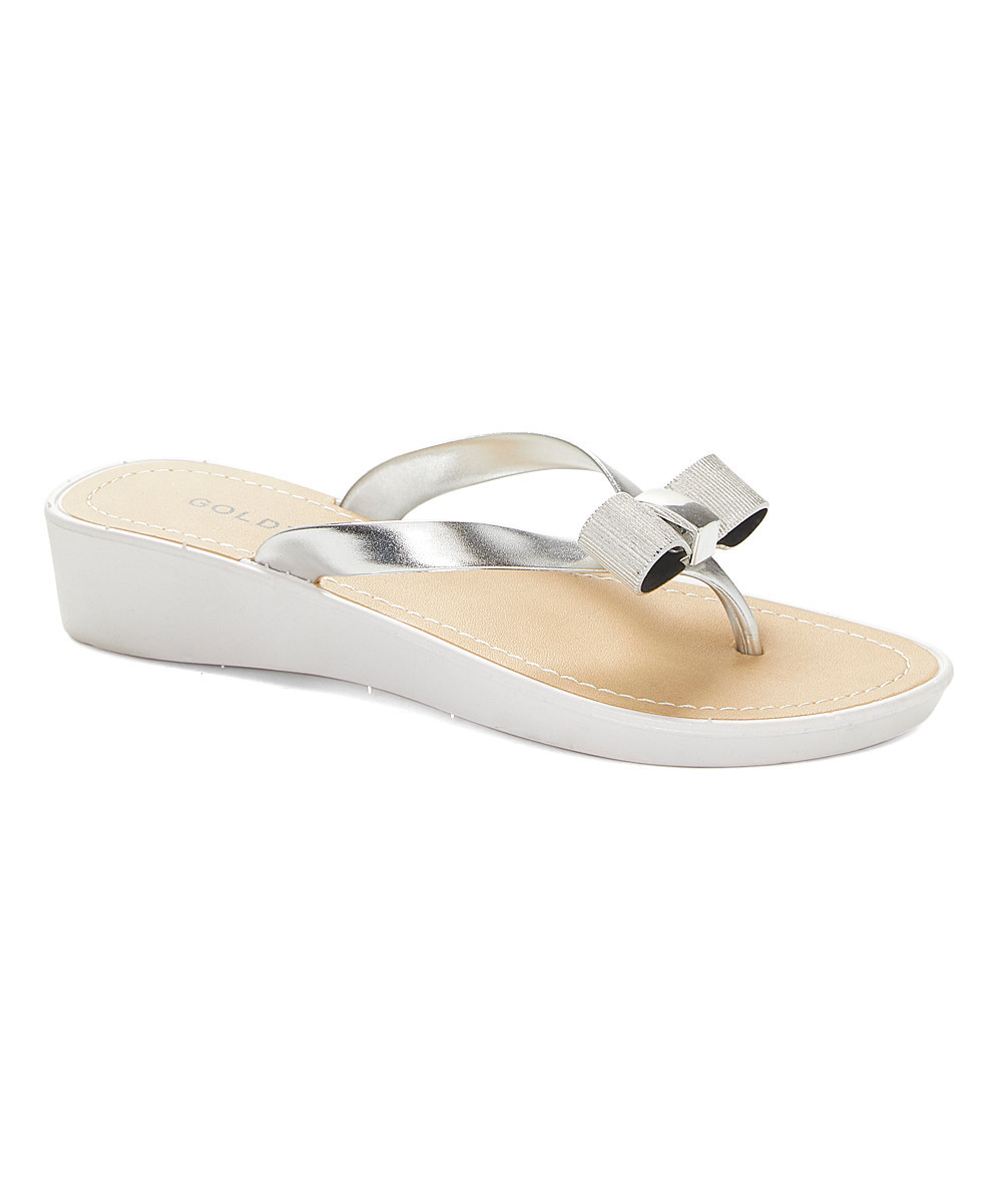 GoldToe Women's Sandals White/Silver - White & Silver Metallic Bow Flip-Flop - Women | Zulily