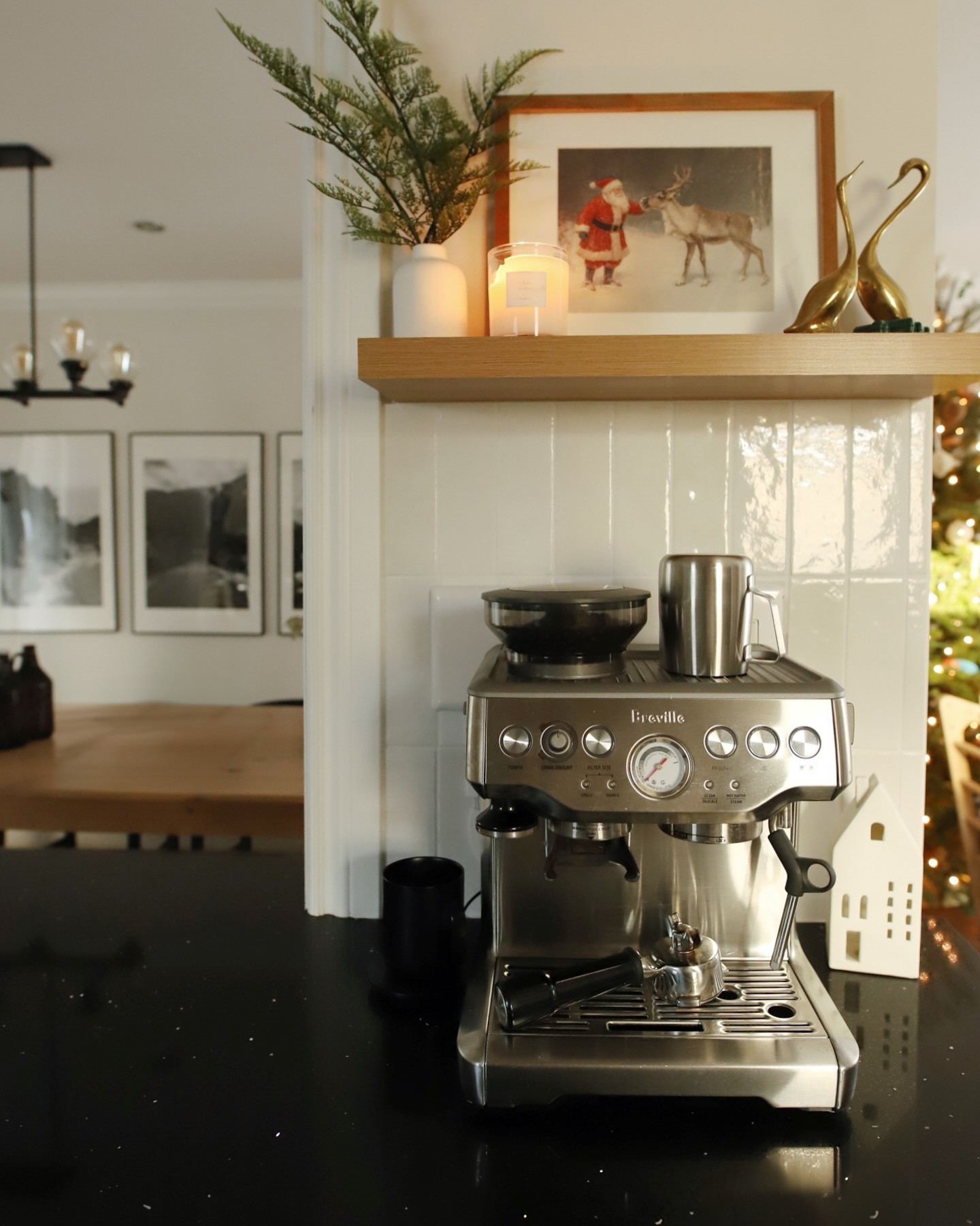 Finally sharing our kitchen updates that I’ve been slowly working on since we moved in two years ago! Still not finished, but here’s what I’ve done so far 👇🏼

- raised the cabinets 6 inches
- removed the shelves that were blocking natural light around the window
- painted the window trim black & added a cafe curtain
- swapped the pot light above the window for a fixture
- installed new backsplash tiles while 6 months pregnant 
- added board and batten on the island and painted it green
- tiled an area for the coffee maker and added a shelf
- swapped the track light for a flush mount fixture
- swapped the hardware 

Things I’d still love to do
- add wallpaper to the glass cabinet
- paint the cabinets (they are a weird off-white that always looks dirty)
- put a cupboard above the fridge
- install crown moulding