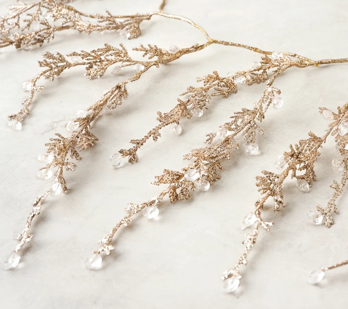 This is the garland of the season! 
Dainty + glitter + clear beads 
makes for the perfect addition to your tree or in a garland on a mantle.

This is going fast too!!

 33"L x 7.5"W x 5.25"H