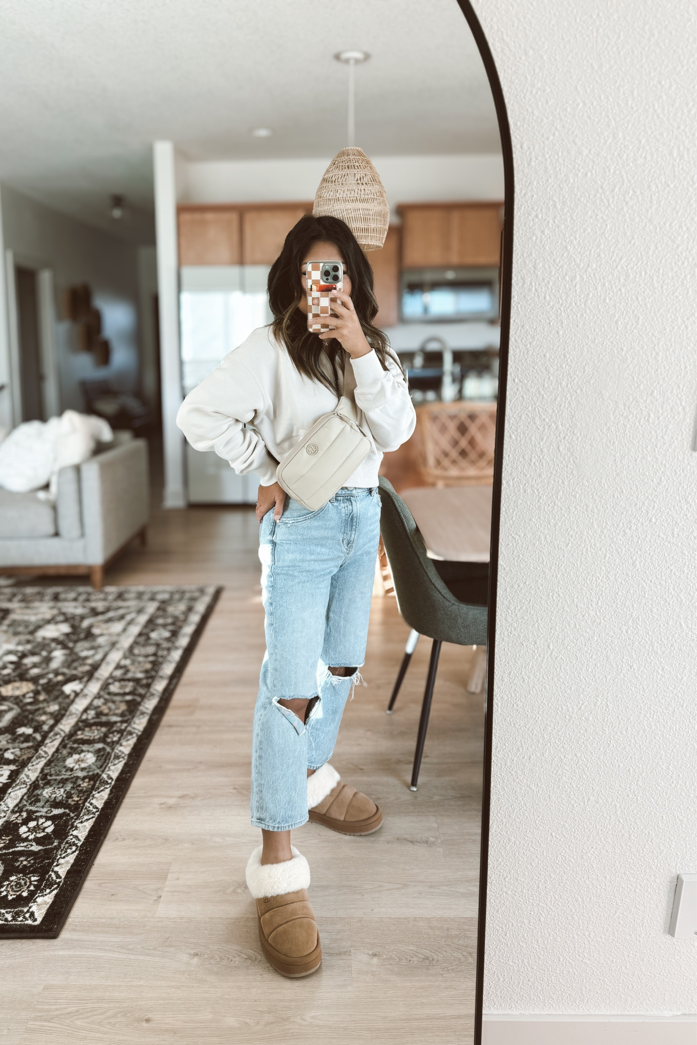 Casual wear for a day of traveling! Nike sweatshirt - Lululemon puffer belt bag - distressed jeans - ugg tazzlita slipper - walli phone case - petite - asian 

#LTKsalealert #LTKtravel #LTKover40