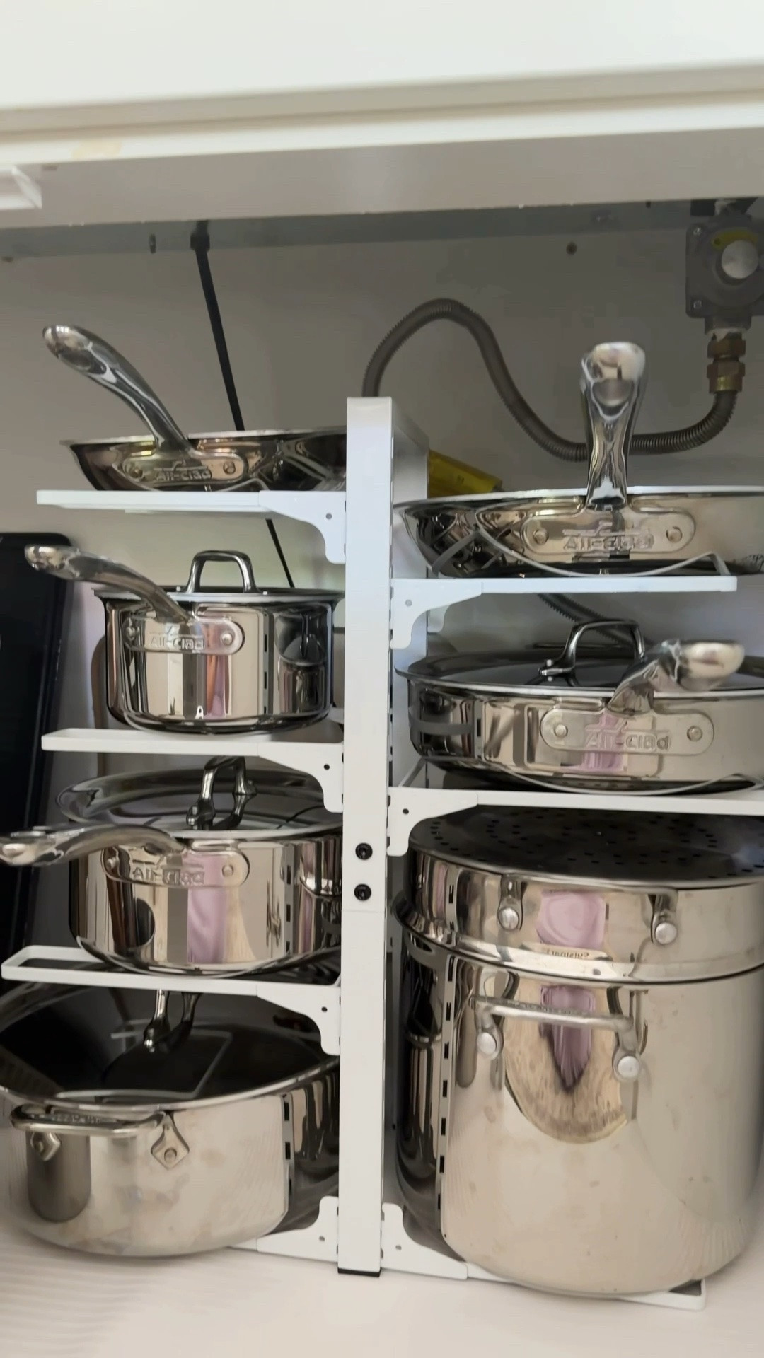 POTS & PANS ORGANIZATION! 🍳✨ We got rid of so many pots and pans and switched to using stainless steel only (inspired by one of you!). It was definitely a learning curve, but I feel so good about the change!

With fewer cookware, it made sense to move everything into the cabinet under the stove. This pots and pans organizer has kept them upright, organized, and easy to grab. #potsandpans #kitchenorganization

#LTKhome #LTKsummer