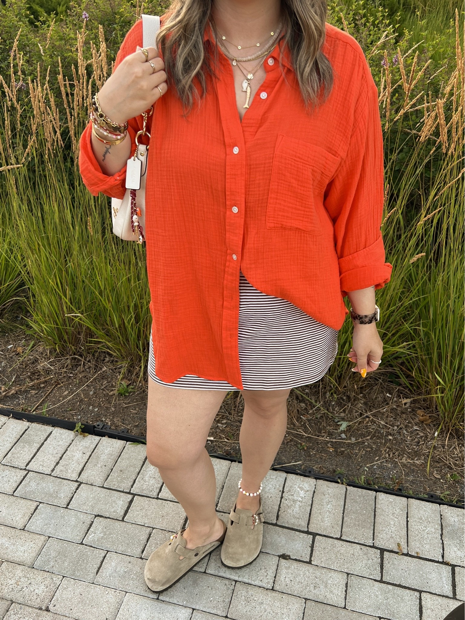 Easy summer outfit! Wearing my usual size L in both the red orange shirt and striped mini skirt (has built in shorts!). Birkenstock Bostons are super comfy, I’m a 9.5-10 shoe and wear size 40

#LTKsummer #LTKsale #LTKmidsize