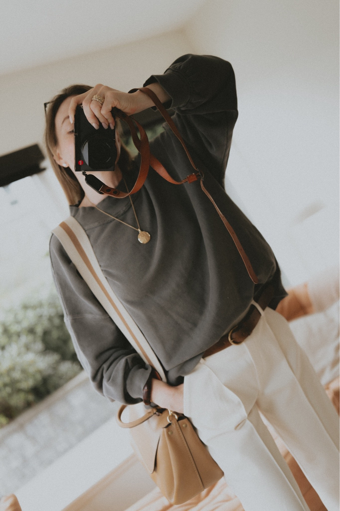 White pants during the first rainy day of the season: laundry day tomorrow 🙄☺️🙃 I say it was worth it! 
Sweatshirt: Free People Palm Springs Pullover 
Pants: Banana Republic 
Belt: Buck Mason 
Bag: Coach 
Jewelry: David Yurman

#LTKootd #LTKWorkwear #LTKTravel