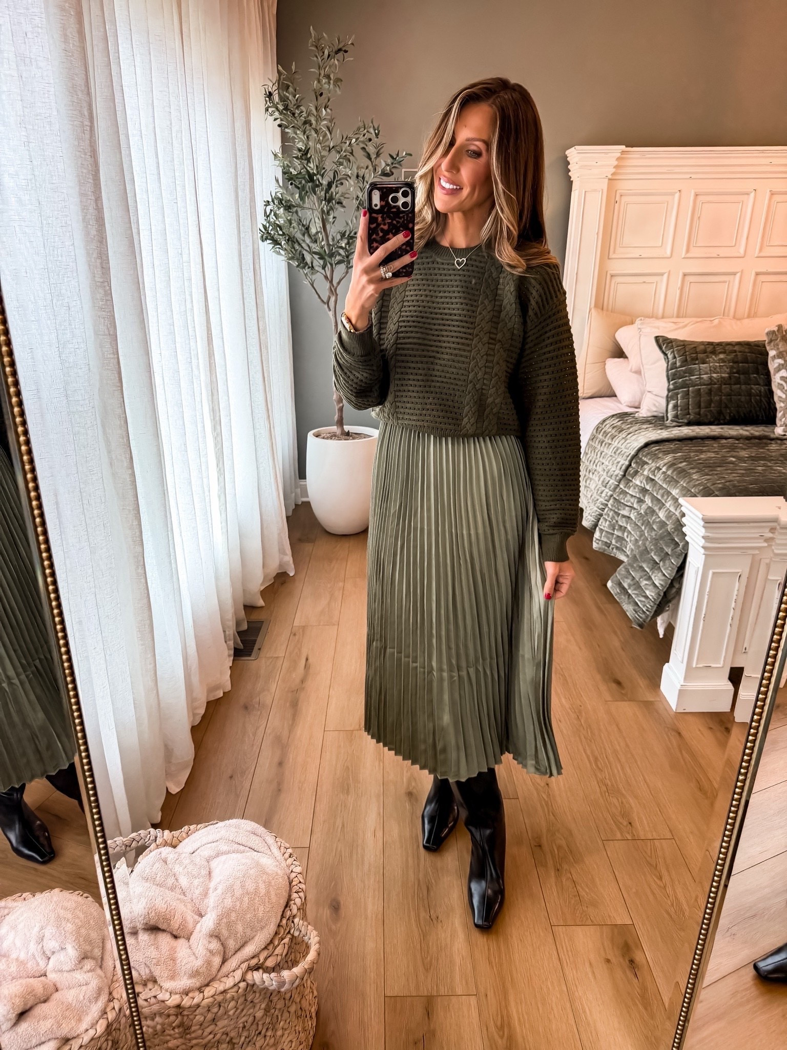 Loving this olive green two piece dress from Avara! 💚🍂 The cable knit sweater and pleated midi skirt are such a pretty combination for fall. Perfect with tall black boots! Wearing a medium.

Avara dress, olive green dress, two piece dress, pleated midi dress, cable knit sweater, fall dress outfit, sweater dress, tall black boots, fall fashion, women over 40 style, themominstyle