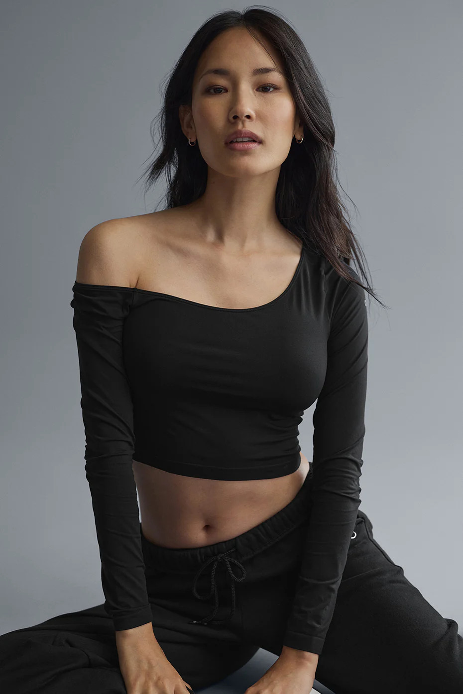 Alo Yoga� | Asymmetric Sheer Glow Long Sleeve Top in Black, Size: XS | Alo Yoga (US)