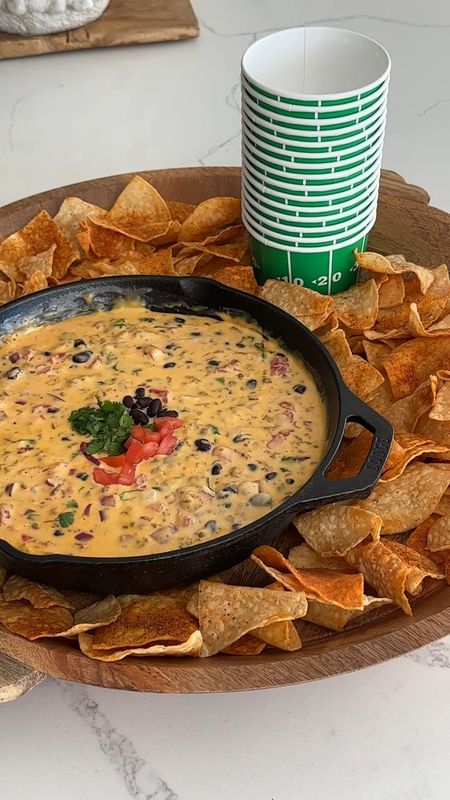 Who you cheering for today? Team Queso over here!🙋🏻‍♀️
Loaded Queso Ingredients:
1/2 lb protein of your choice (sausage, ground beef) 
3/4 cup half and half
16 oz Velveeta cheese, cubed
1 cup pepper jack cheese
1 can rotel, drained 
1 cup black beans, rinsed and drained 
1/3 cup red onion, chopped
1/4 cup cilantro, chopped 
chips of your choice 
Let's go!!! 
Brown your protein and drain the grease.
Lower the heat and add half and half, Velveeta and Pepper Jack. Stir until just melted. 
Add beans, cilantro, rotel and onion.
Stir and serve with chips!.

#LTKhome #LTKSeasonal #LTKparties