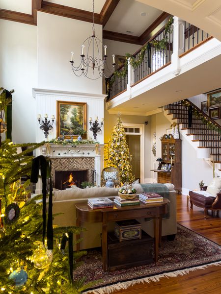 Traditional Christmas family room with blue, green and gold complete with 9 foot king of Christmas tree! 

#LTKHoliday #LTKstyletip #LTKhome
