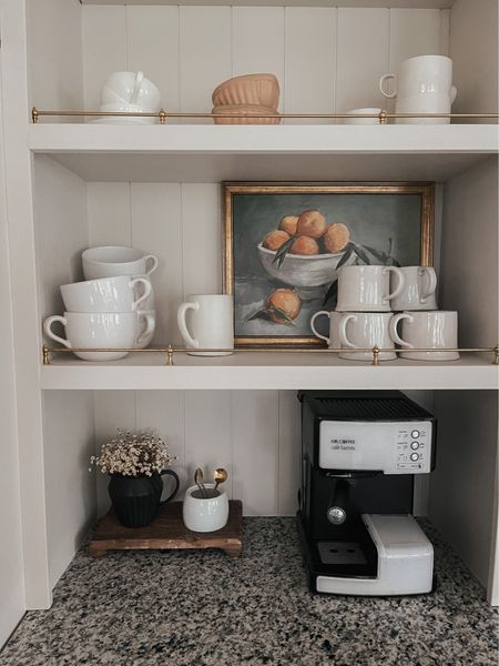 coffee station in our kitchen 💛 
coffee mugs
creamer
artwork
espresso machine



#LTKhome