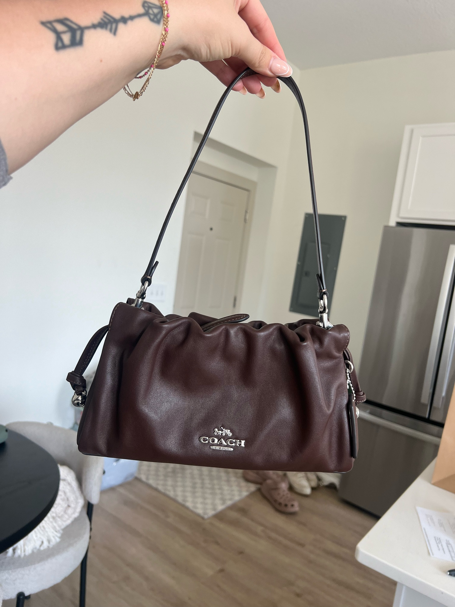 In my brown era 🤎 obsessed with this little scrunch Coach bag! 