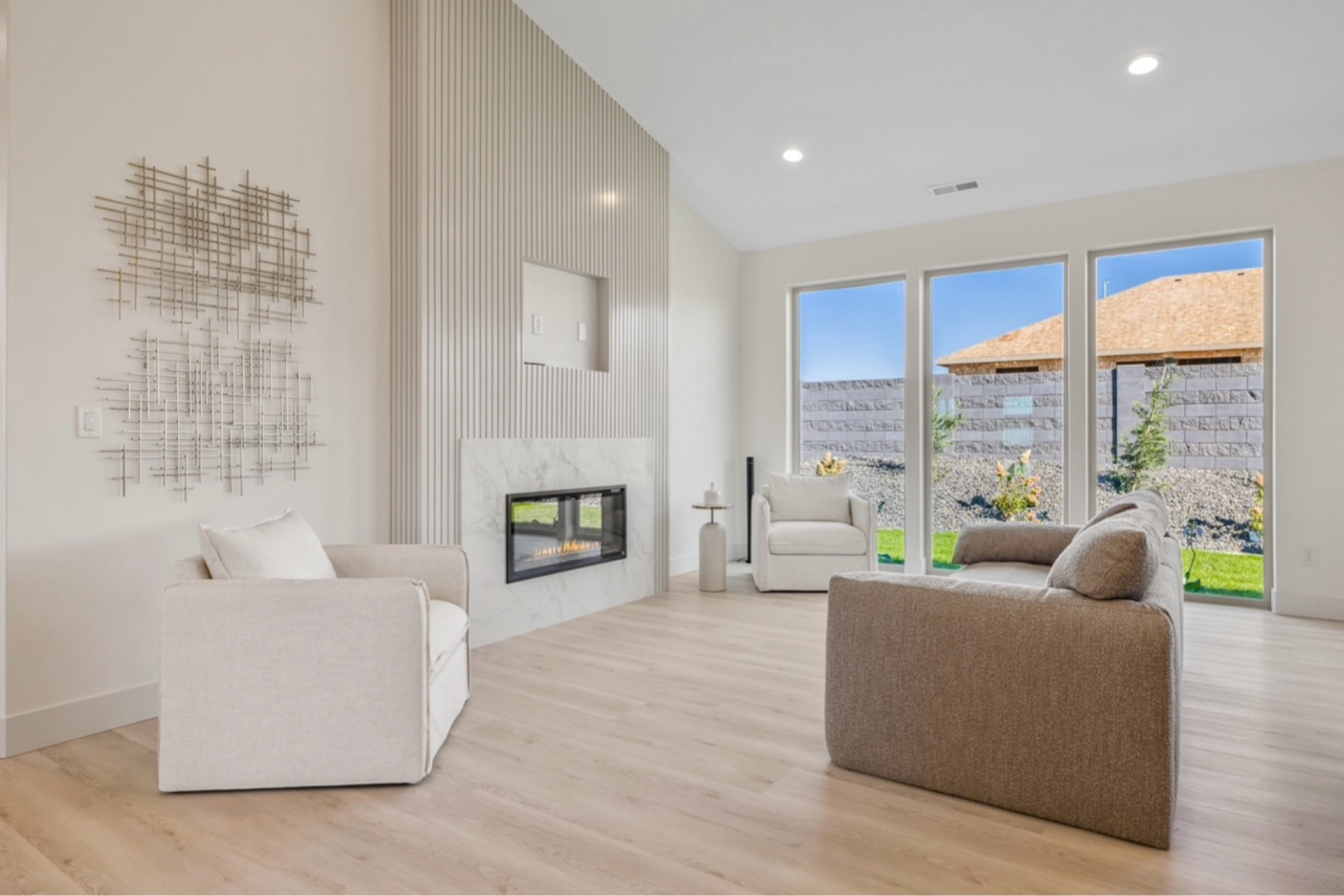 Modern farmhouse living room. Electric fireplace with panels. Slat wall fireplace wall. Lounge chair. White accent chair. Cream accent chair. Hotel collection diffuser My Way. Boucle gray sofa. Boucle white sofa. Metal wall art. LTK home design 

#LTKCon #LTKActive #LTKU