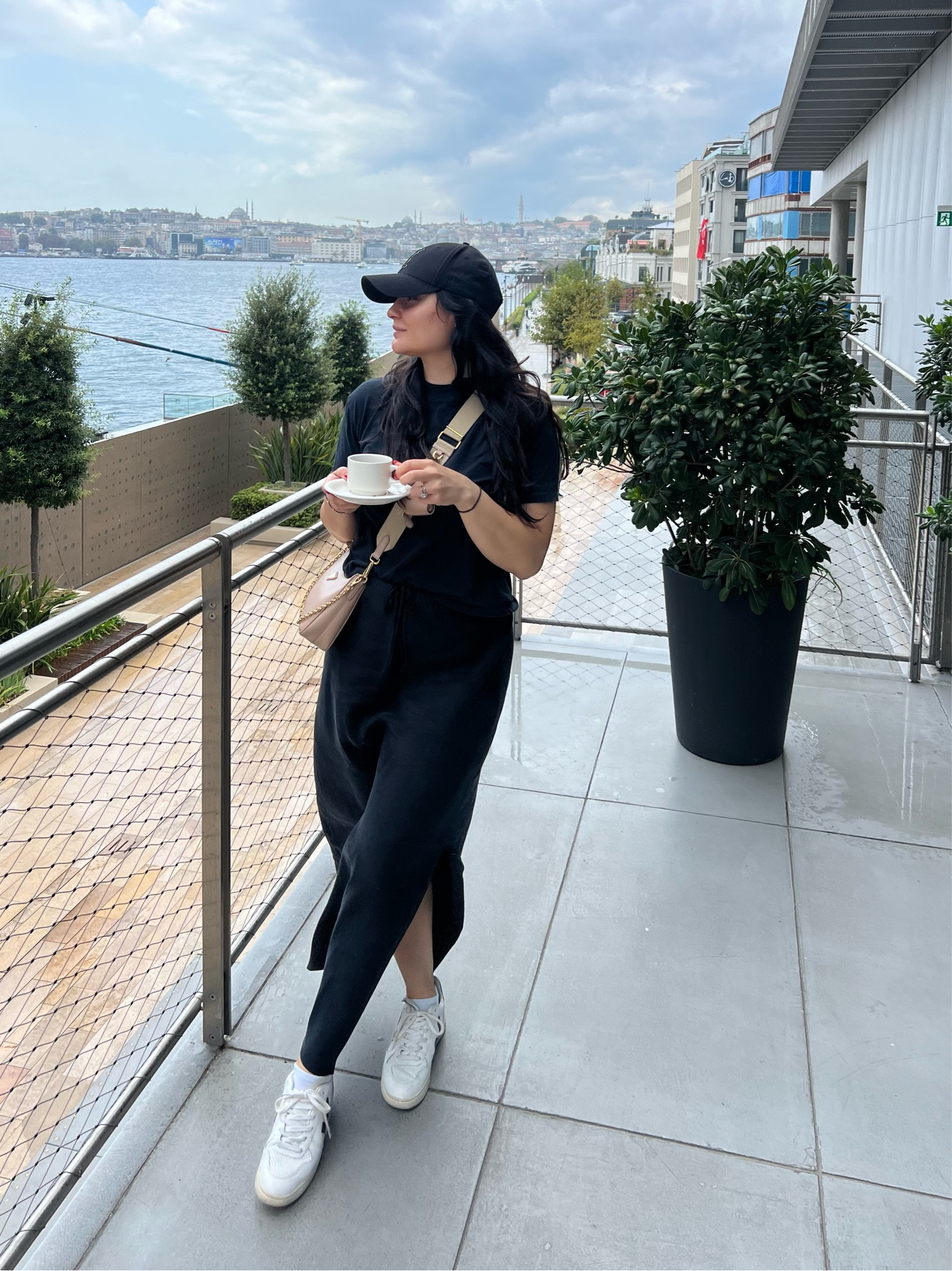 Easy styling for a day in the city. Maxi slip skirt (size up) + soft tee (tts)  + baseball cap. New balance 550s are tts. 

Istanbul, city outfit, travel outfit, all black outfit 

#LTKTravel #LTKFindsUnder100 #LTKStyleTip