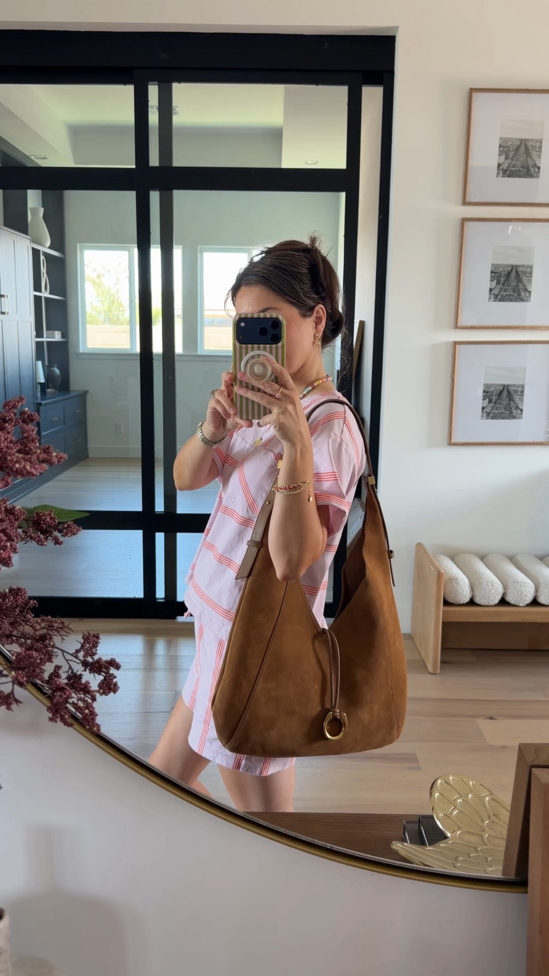 If you’re petite and think a big bag will swallow you, this is the exception

The slouchy suede shape makes it read as effortless instead of oversized. It’s marked down for NSALE along with this striped set I basically live in this time of year

#LTKSaleAlert #LTKootd