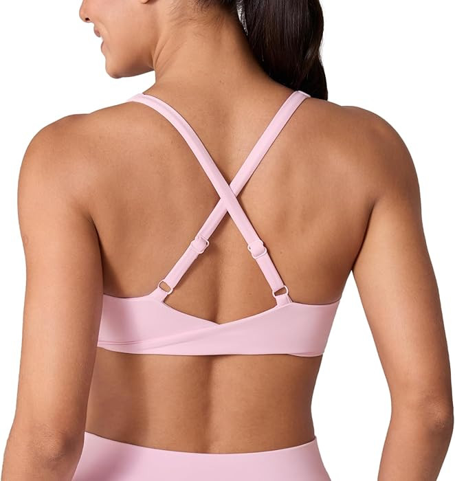 UNISSU Hugcurve Adjustable Twist Cross Back Sports Bra for Women V Neck Wireless Padded Yoga Work... | Amazon (US)