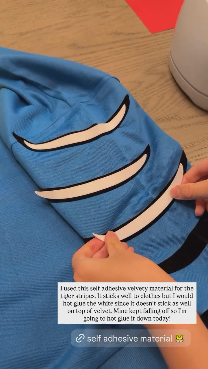 Self adhesive material! I used this self adhesive velvety material for the tiger stripes. It sticks well to clothes but I would hot glue the white since it doesn't stick as well on top of velvet. Mine kept falling off so I'm going to hot glue it down today. Kpop Demon Hunters Costume

#LTKFindsUnder50 #LTKStyleTip #LTKHalloween