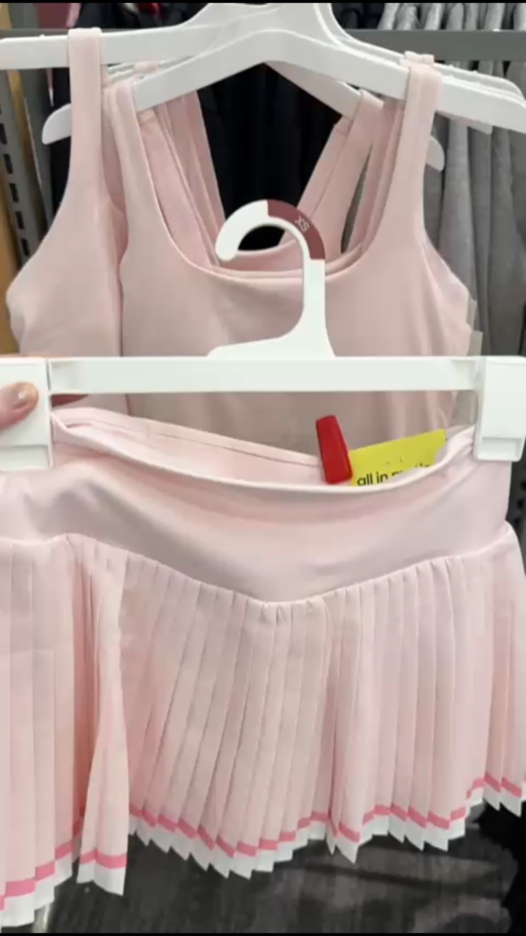 A flattering soft pink activewear set featuring a pleated tennis skirt with built-in shorts and a matching sleeveless tank top.

#LTKootd #LTKfitnessgoals