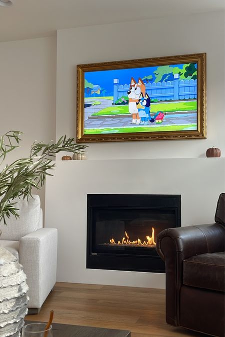 Living room decor, frame tv, brass frame, live olive branches, home decor 

#LTKhome #LTKunder100