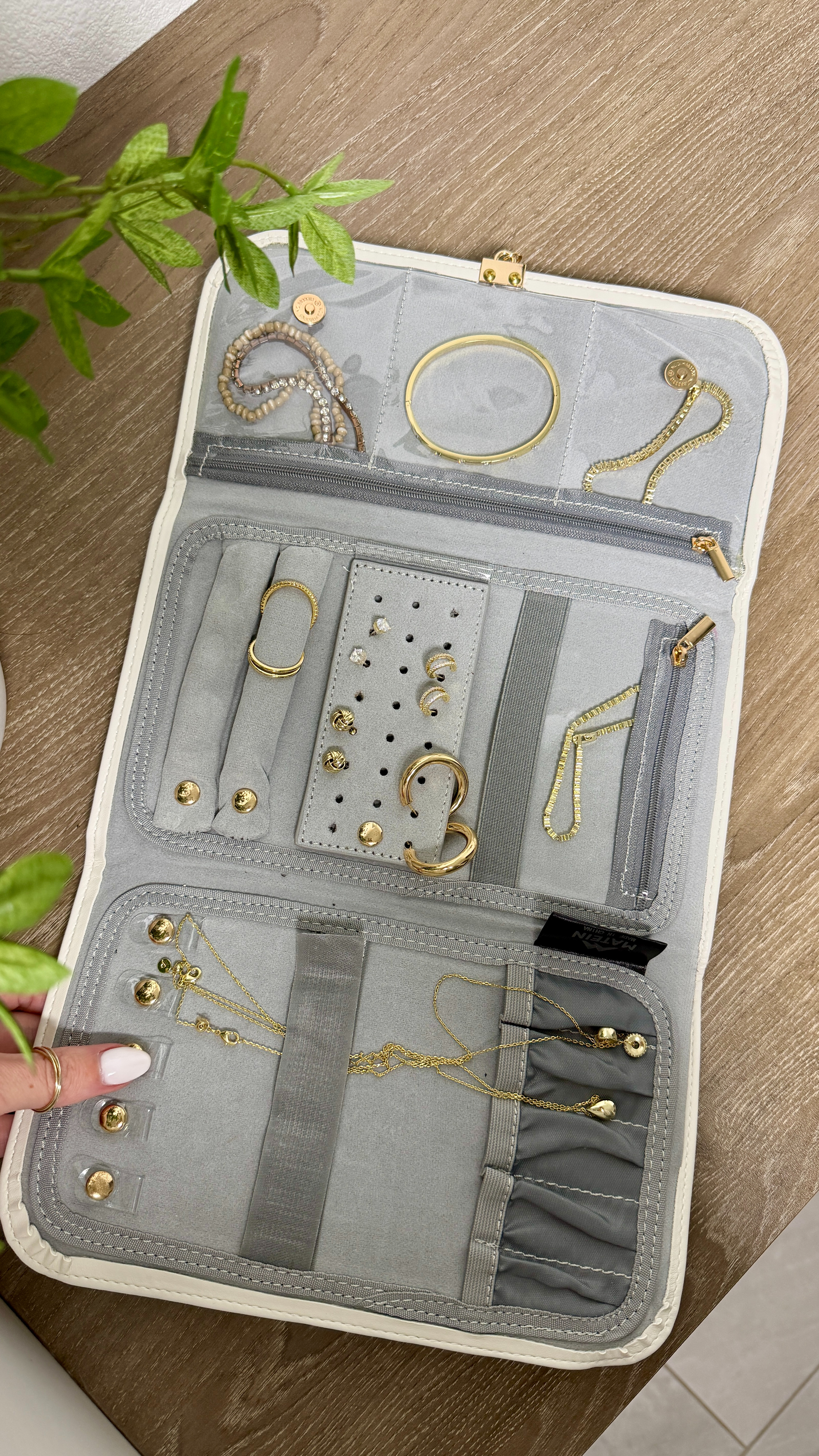 My jewelry travel organizer 🤍 It keeps everything protected and completely tangle-free on the go - peep some of my favorite everyday jewelry too. 

 #LTKTravel