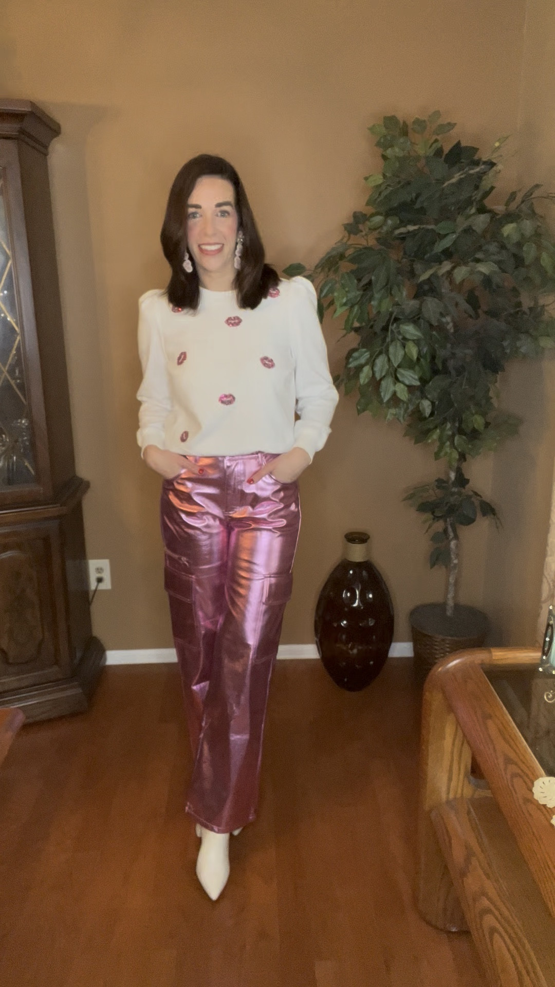 Pink sequin lips graphic sweatshirt (small). High rise pink metallic cargo pants (small). White boots (8.5). #graphicsweatshirt #sweatshirt #lipssweatshirt #lipstop #metallicpants #metalliccargopants #pinkmetallicpants #pinkpants #cargopants #whiteboots #boots #valentinesdayoutfit #valentinesday 
Valentine’s Day Outfit 

#LTKStyleTip #LTKFindsUnder100 #LTKSeasonal