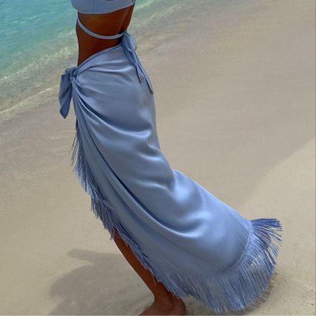  The chicest sarong in luxe satin and features a tonal fringe trim border.

#LTKSwim #LTKStyleTip #LTKTravel