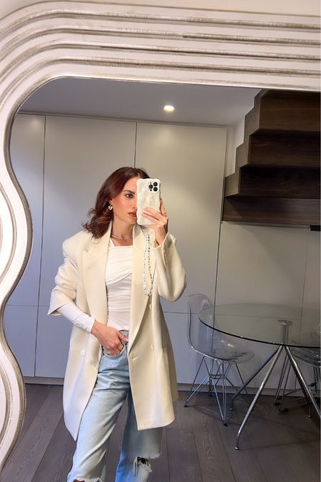 White blazer, asymmetrical white top, and the perfect blue jeans

#LTKeurope #LTKstyletip