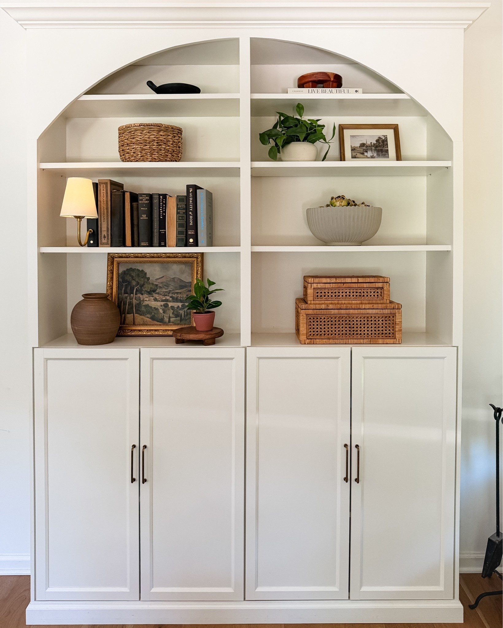 Want a tip for styling bookshelves? Use the triangle method to fill them.